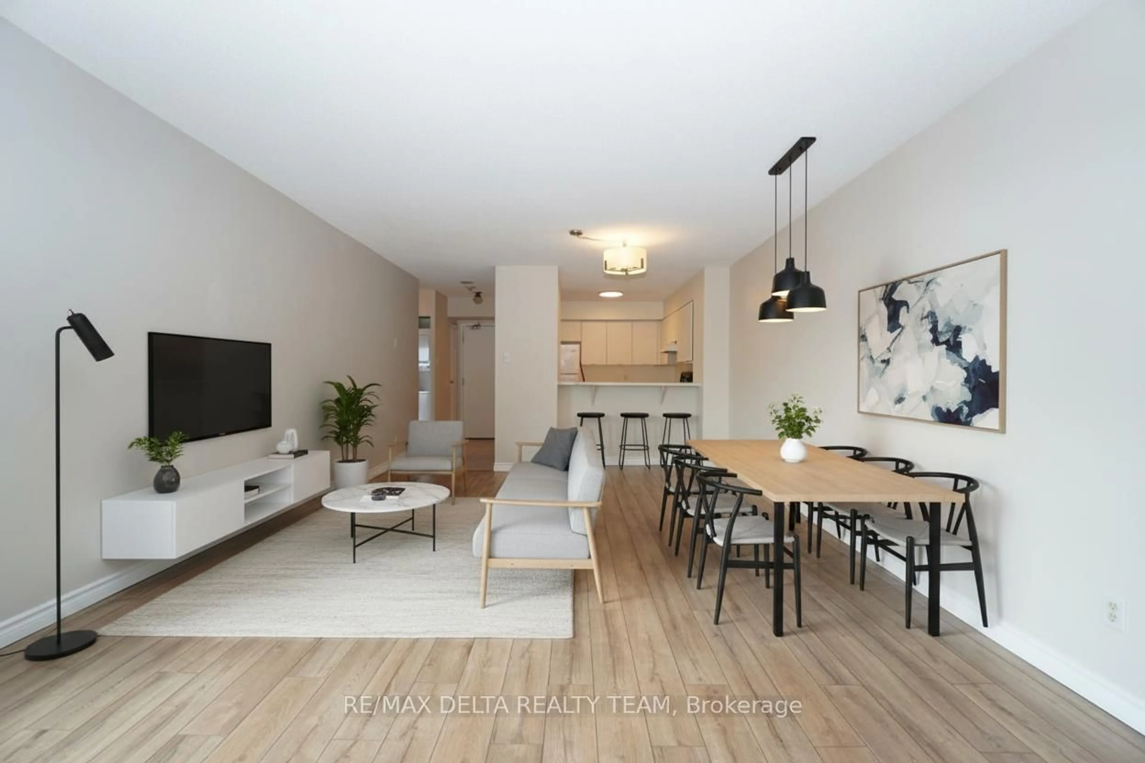 Living room with furniture, wood/laminate floor for 545 St Laurent Blvd #1506, Ottawa Ontario K1K 4H9