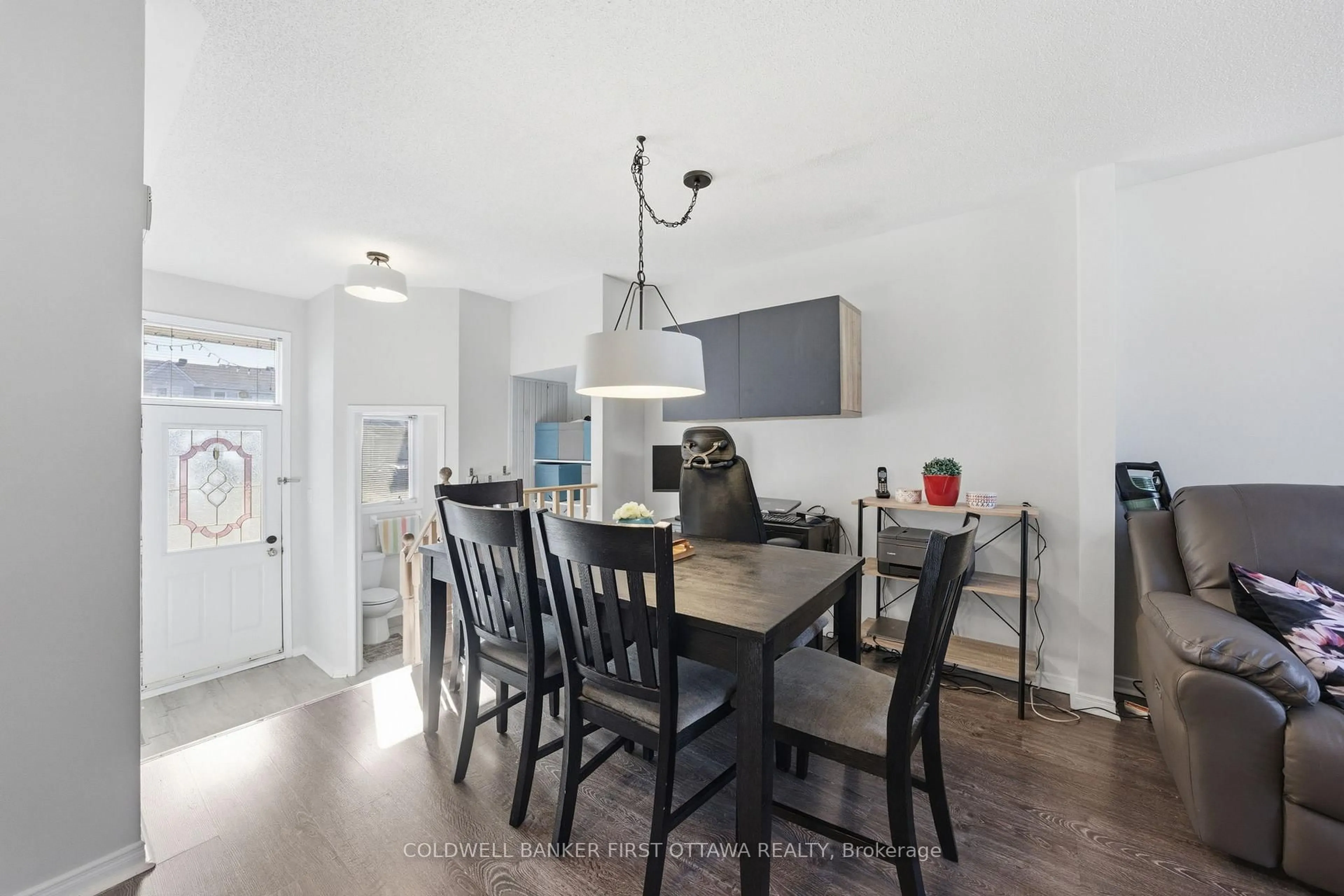 Open concept kitchen, wood/laminate floor for 1902 Hennessy Cres, Ottawa Ontario K4A 3X7