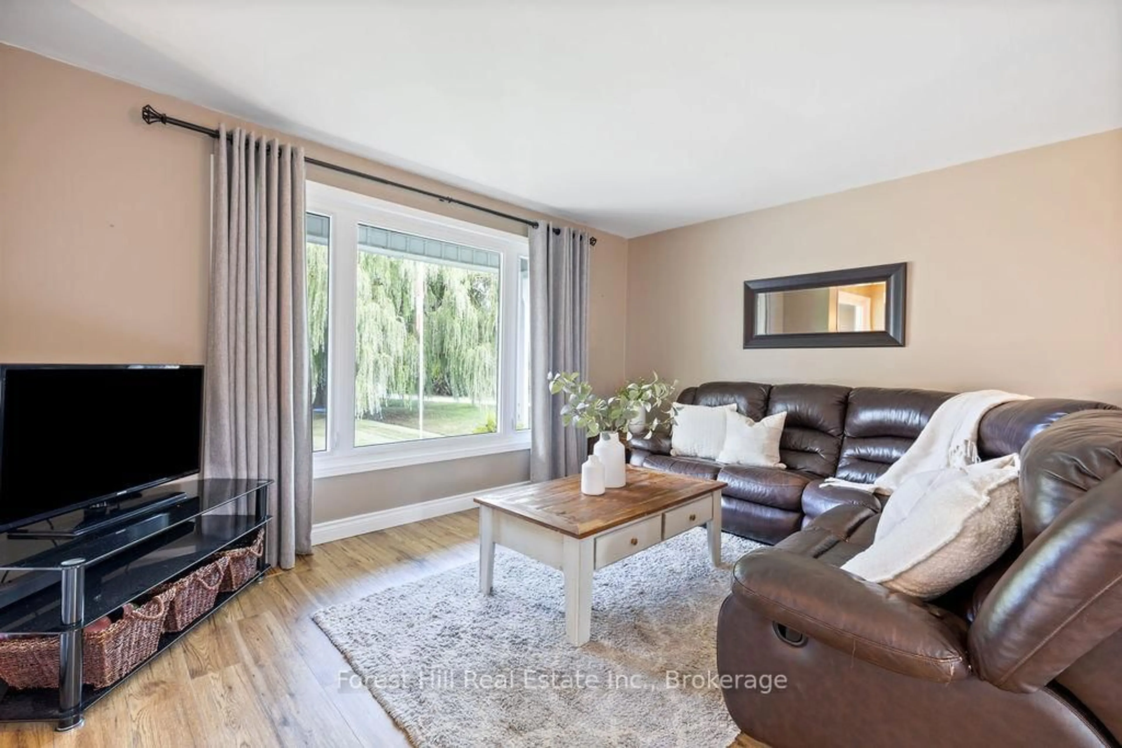 Living room with furniture, wood/laminate floor for 197716 7 Grey Rd, Meaford Ontario N4L 1W7