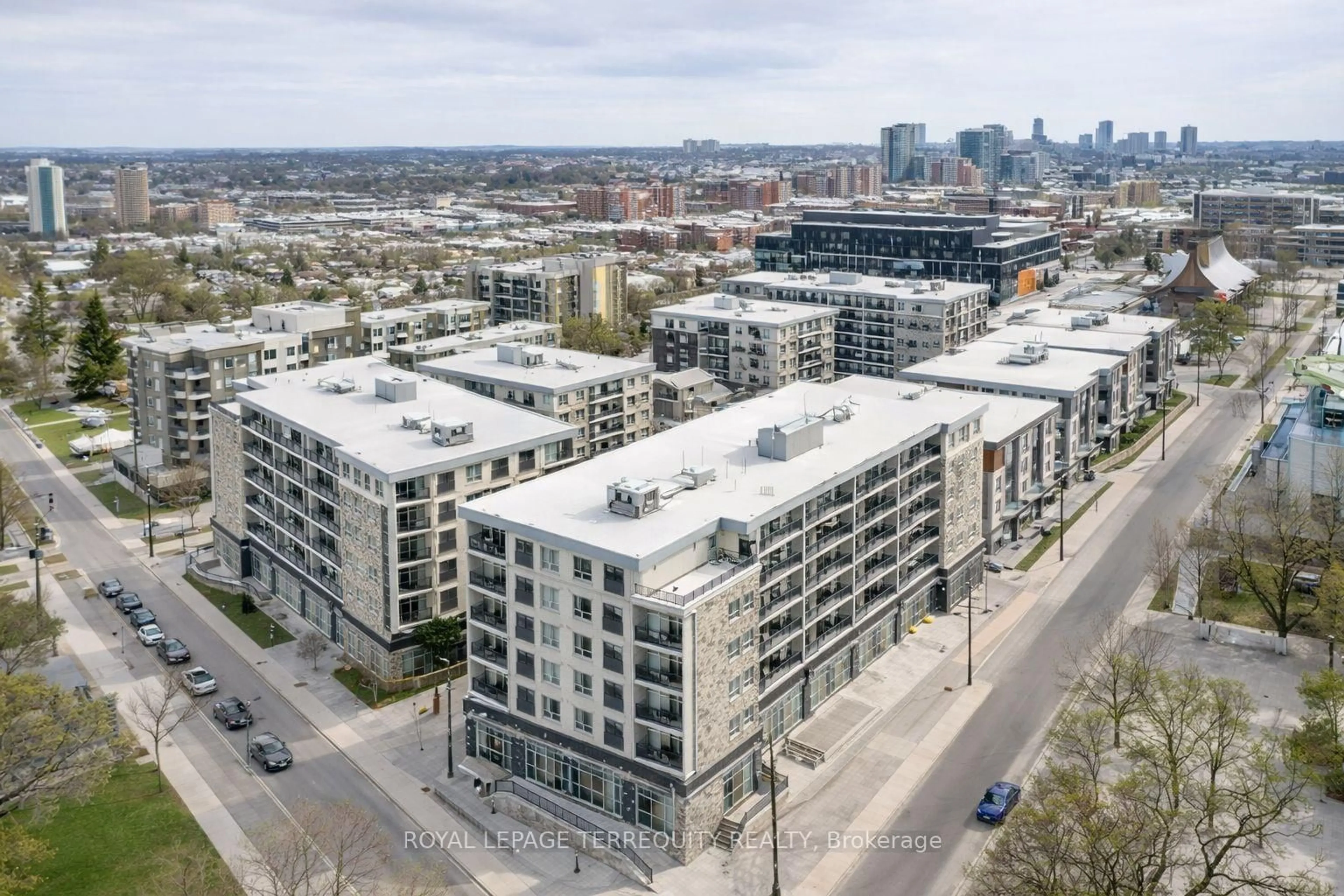 A pic from outside/outdoor area/front of a property/back of a property/a pic from drone, city buildings view from balcony for 275 Larch St #F106, Waterloo Ontario N2L 0J5