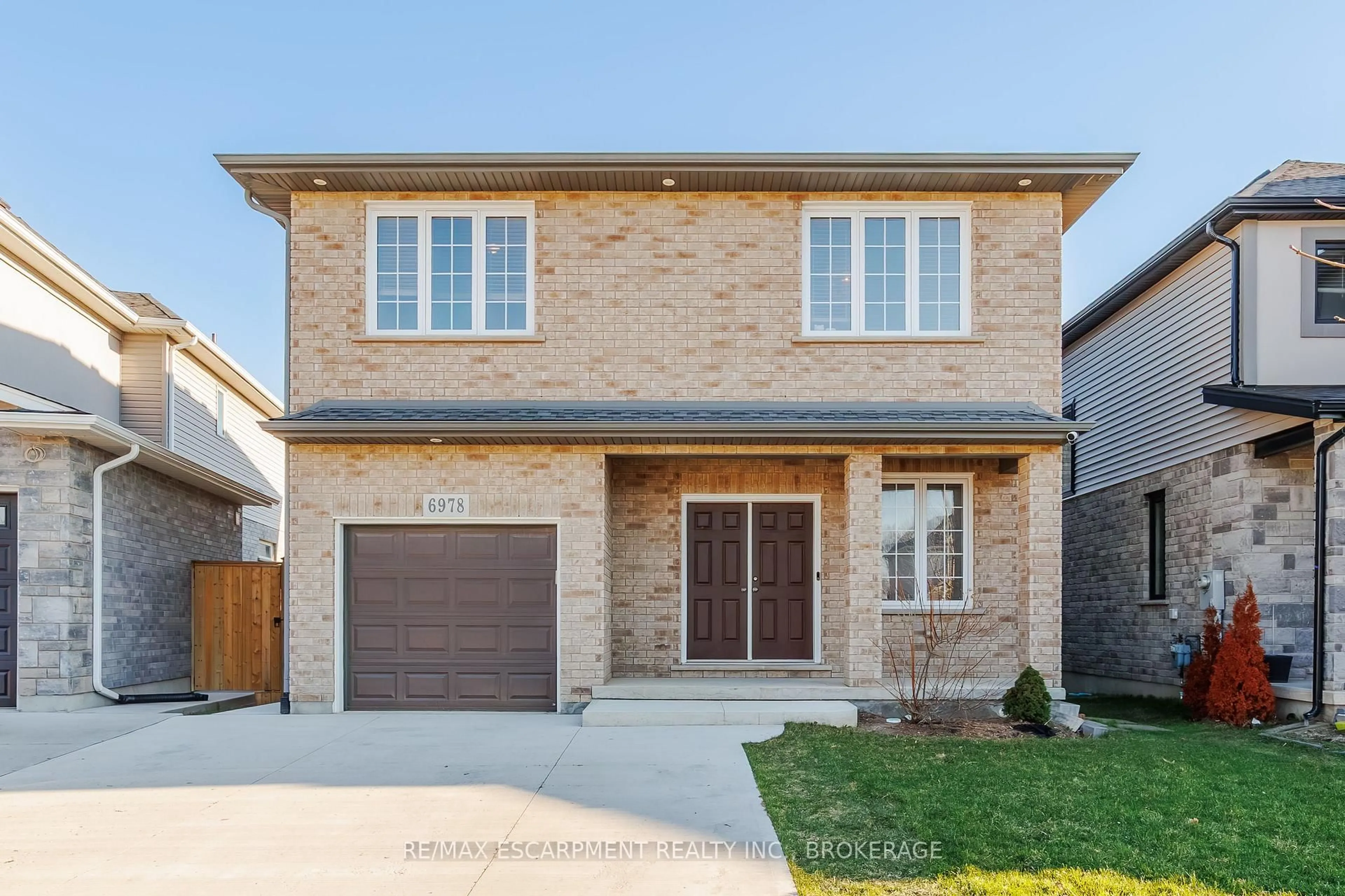 Home with brick exterior material, street for 6978 Optimist Lane, Niagara Falls Ontario L2E 0B1
