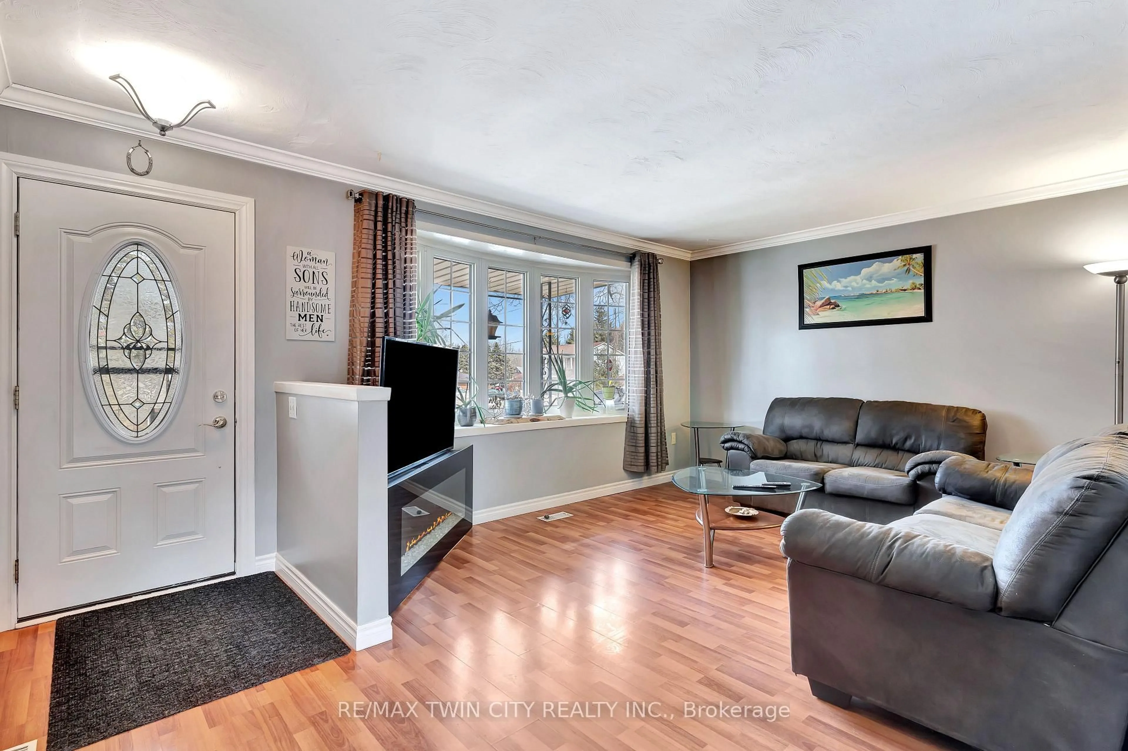 Living room with furniture, wood/laminate floor for 22 Victoria St, North Dumfries Ontario N0B 1L0