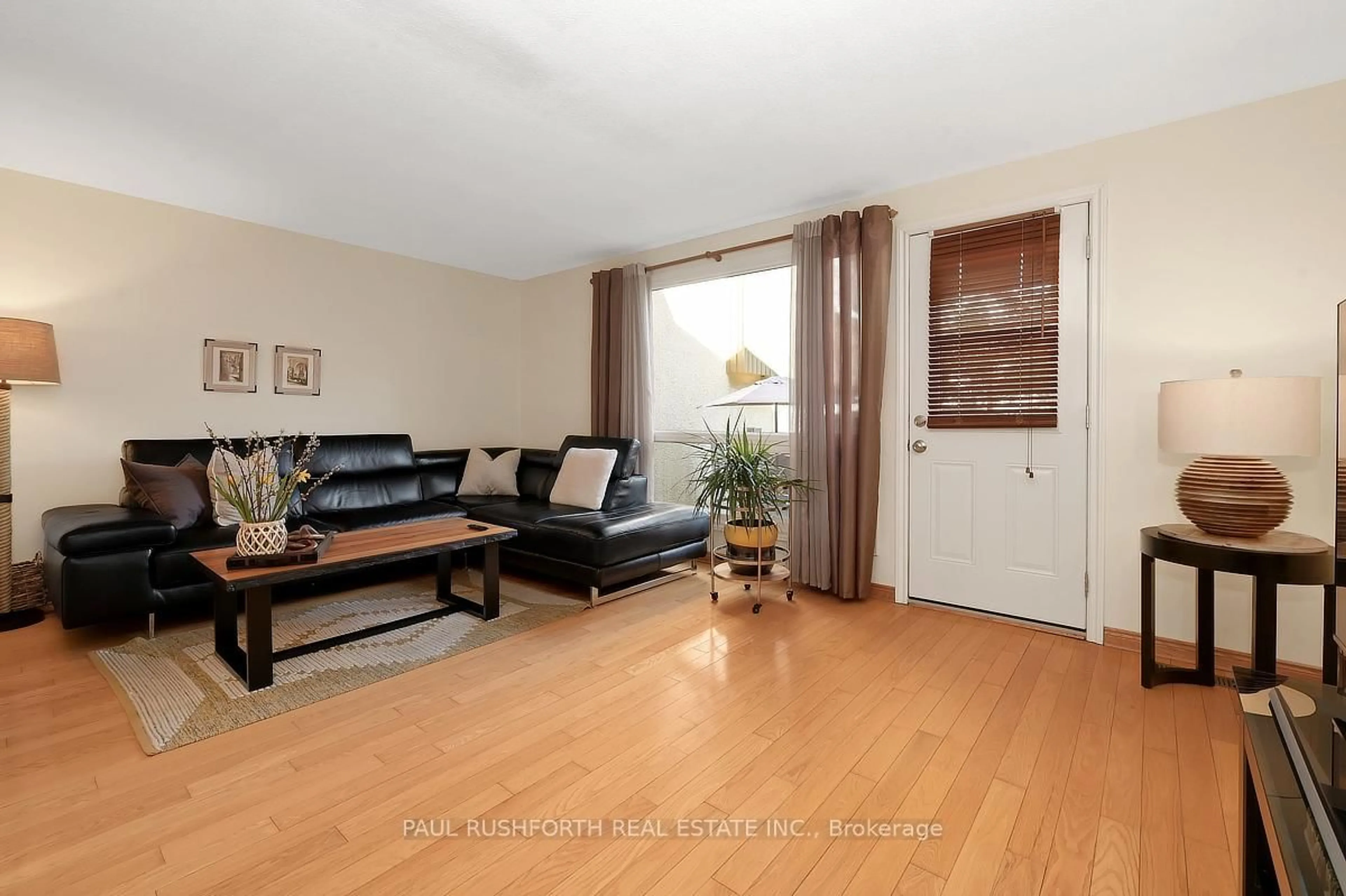 Living room with furniture, wood/laminate floor for 1400 Lassiter Terr, Ottawa Ontario K1J 8N3