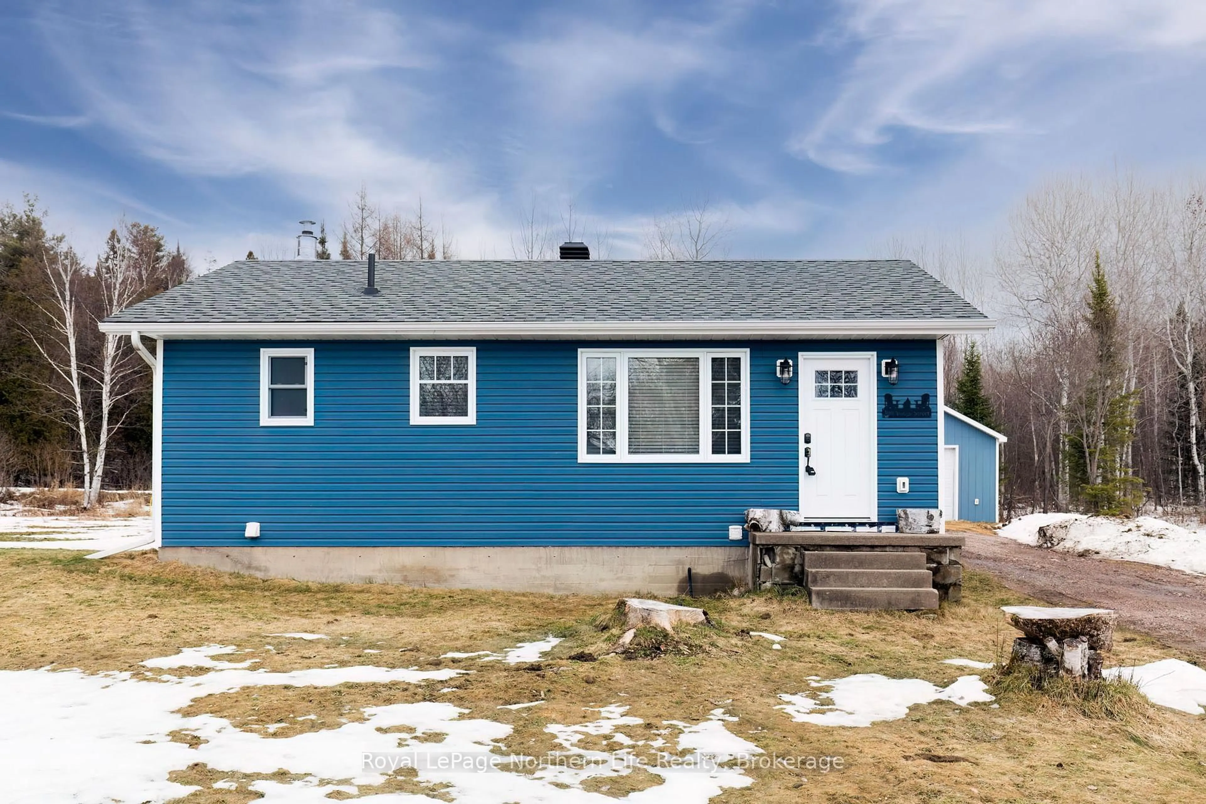 Home with vinyl exterior material, street for 300 Yonge St, Bonfield Ontario P0H 1E0