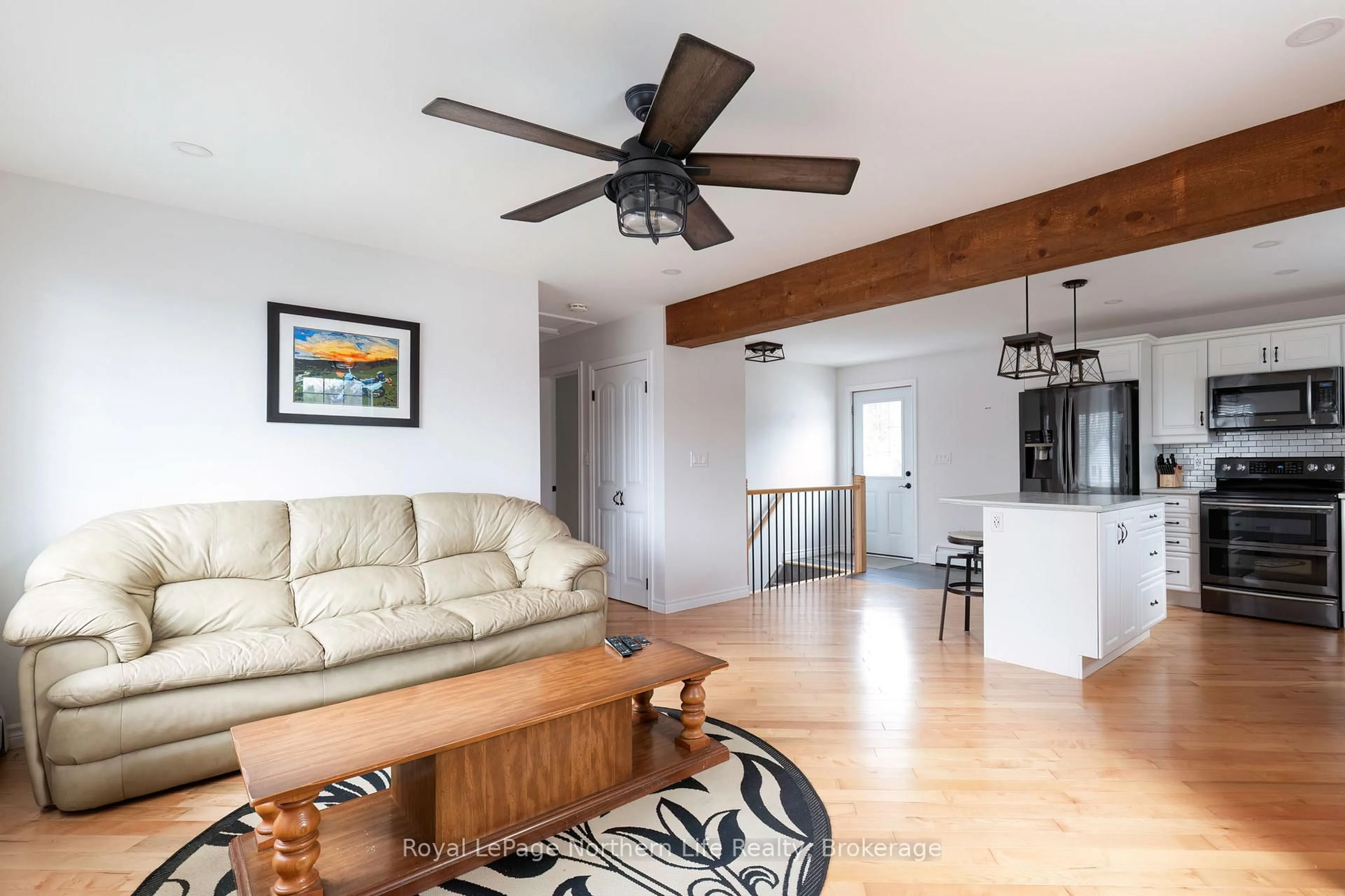 Living room with furniture, wood/laminate floor for 300 Yonge St, Bonfield Ontario P0H 1E0