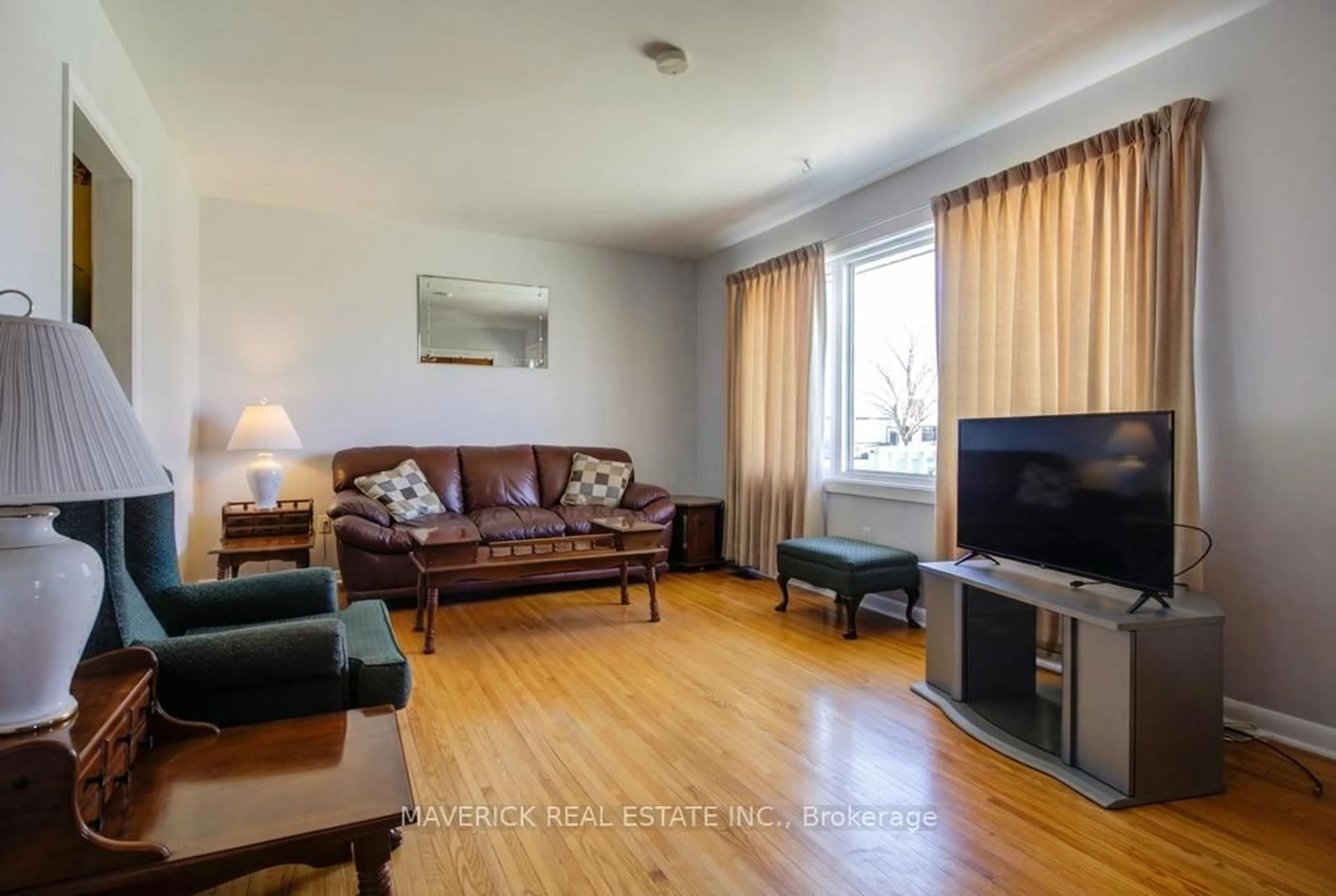 Living room with furniture, wood/laminate floor for 169 Byron St, Zorra Ontario N0M 2M0