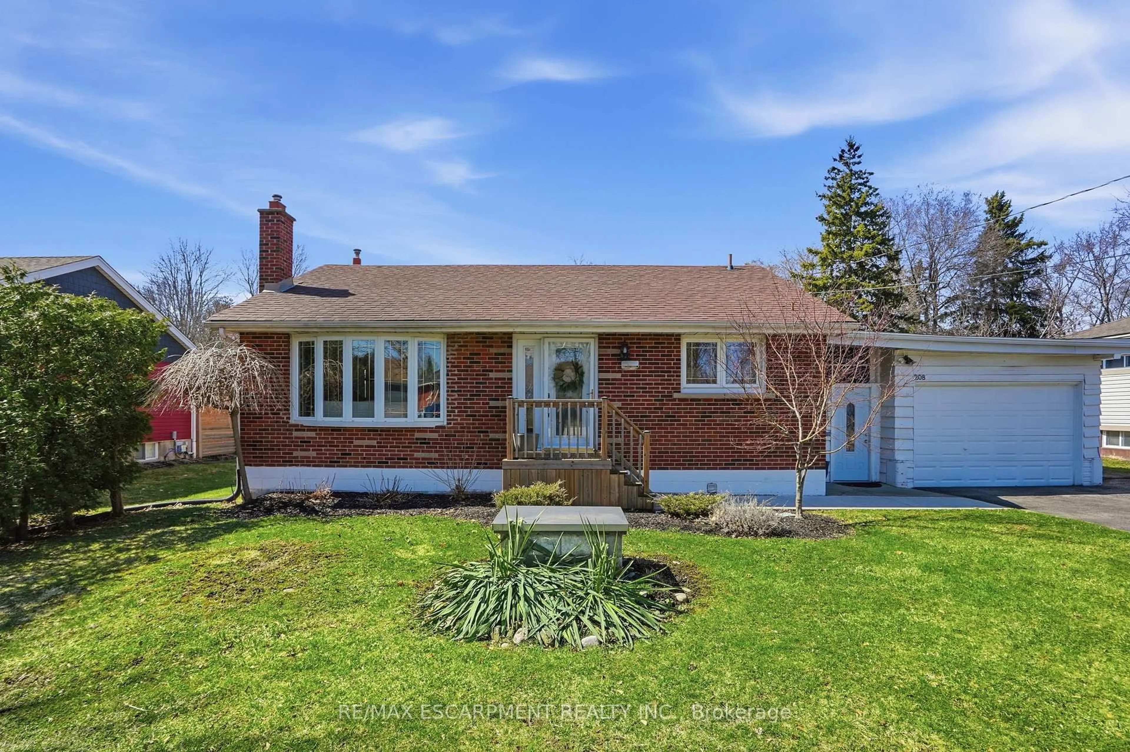 Home with brick exterior material, street for 208 Seneca Ave, Hamilton Ontario L9B 1M2
