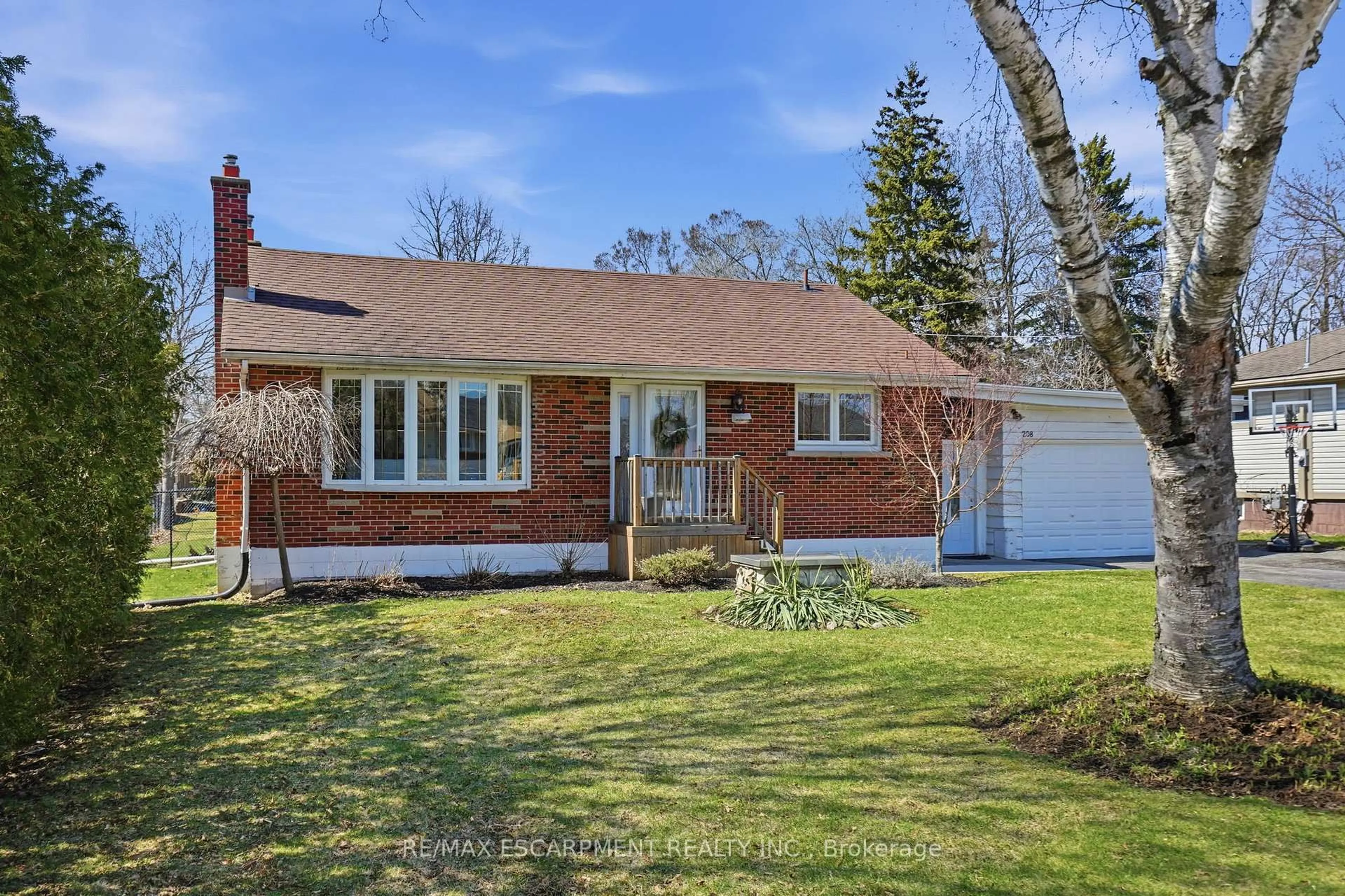 Home with brick exterior material, street for 208 Seneca Ave, Hamilton Ontario L9B 1M2