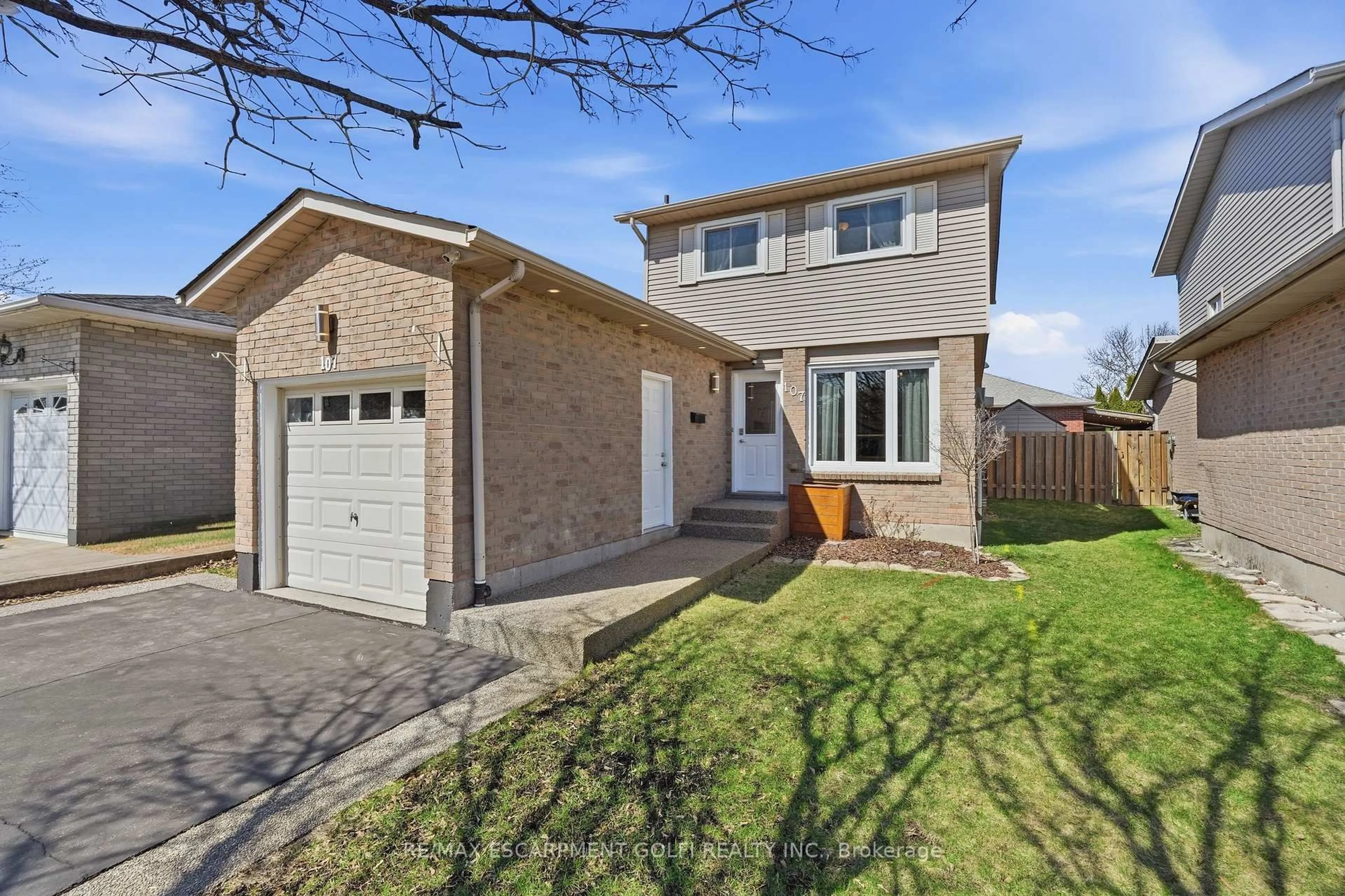 Home with brick exterior material, street for 107 Broughton Ave, Hamilton Ontario L8W 3S7