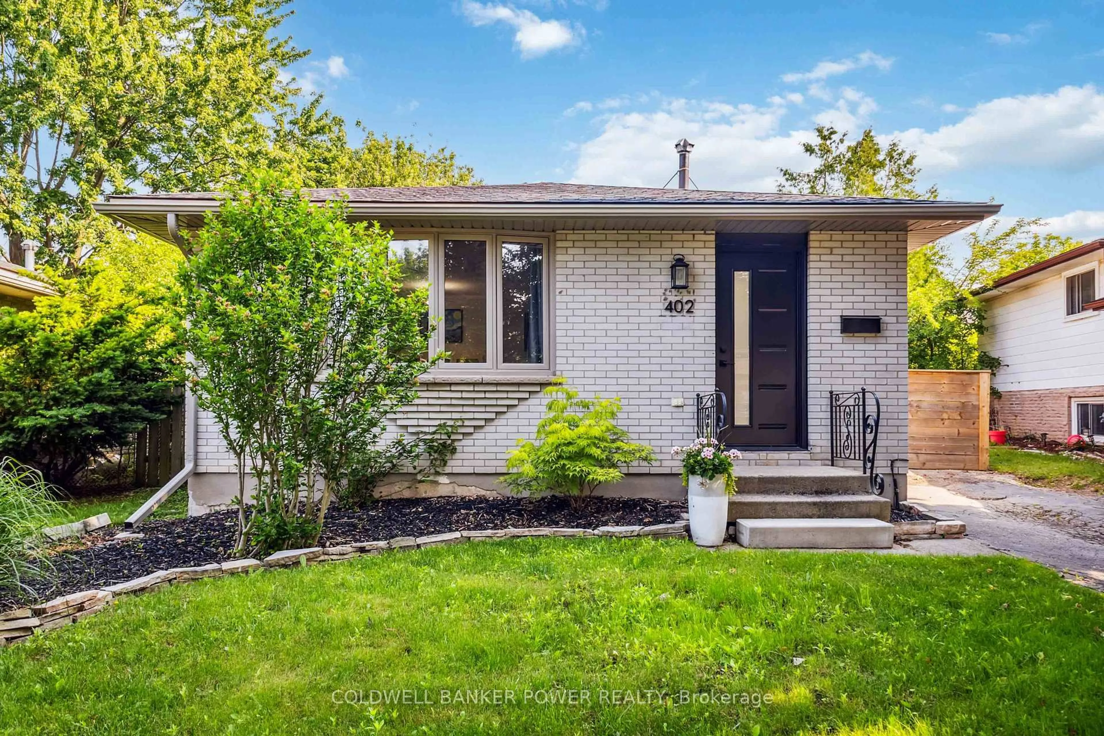 Home with brick exterior material, street for 402 Ferndale Ave, London South Ontario N6C 2Y8