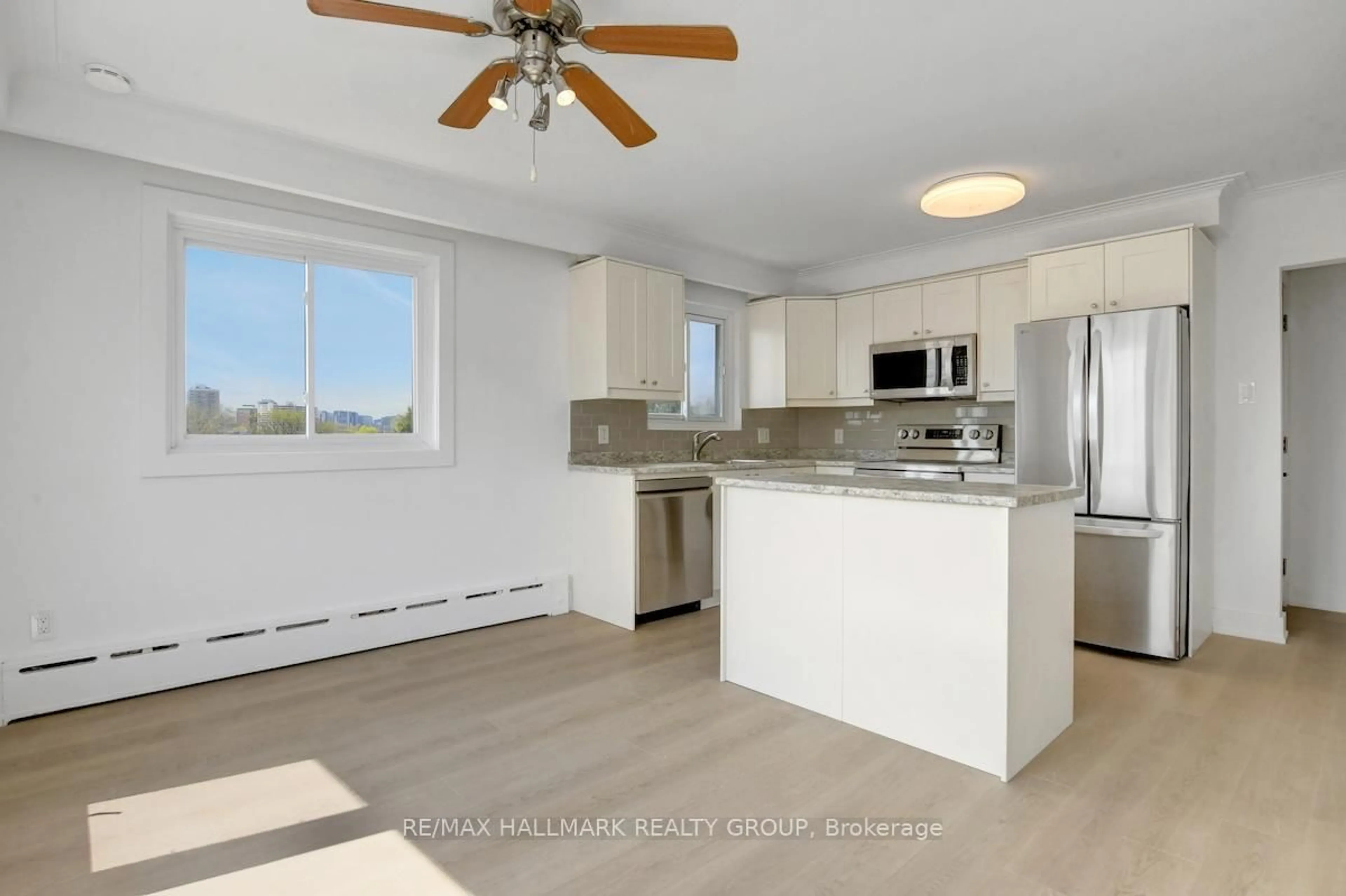 Open concept kitchen, wood/laminate floor for 269 Michel Circ, Ottawa Ontario K1L 7P4