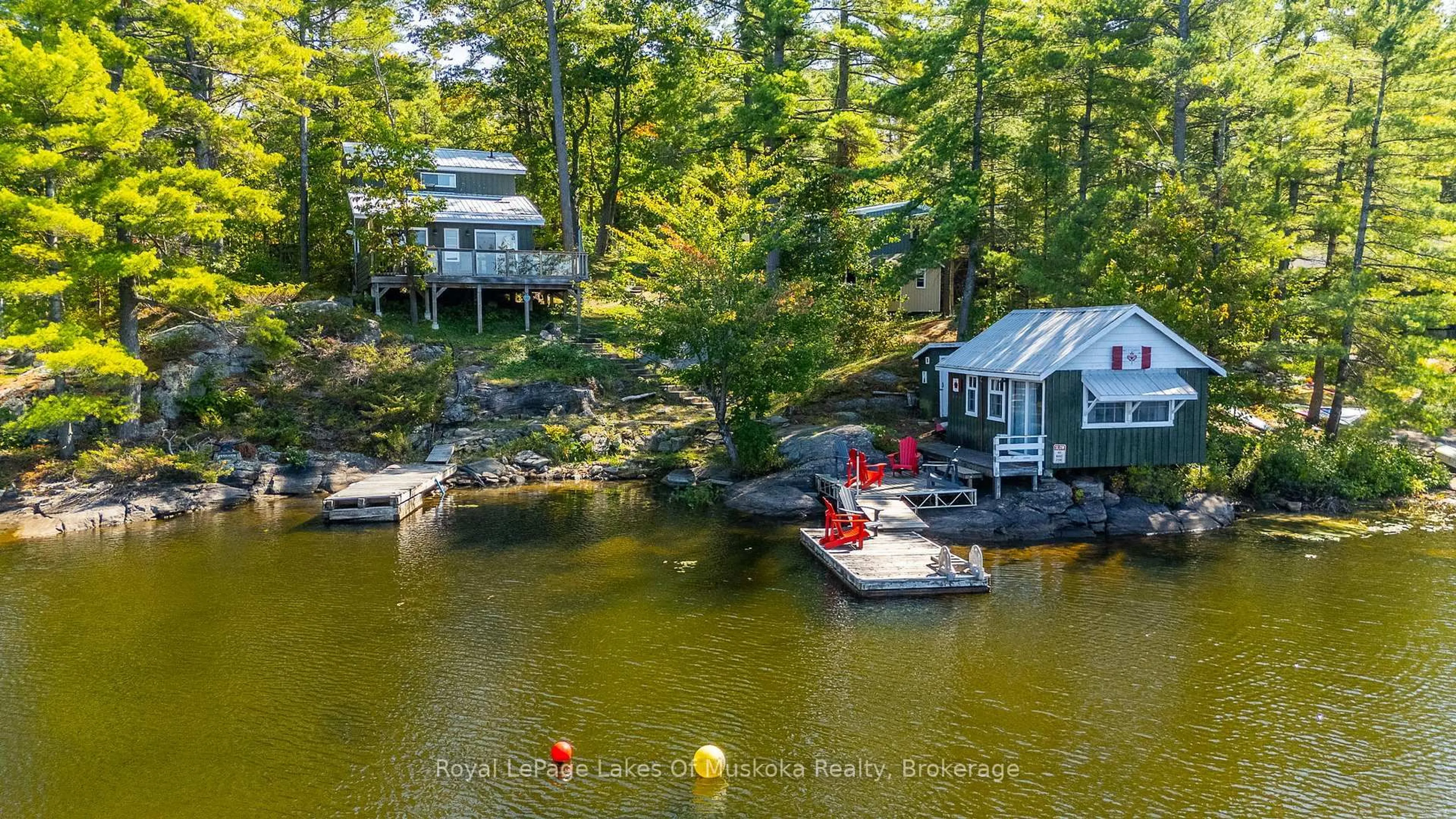 A pic from outside/outdoor area/front of a property/back of a property/a pic from drone, water/lake/river/ocean view for 1379 Muskoka Road 169 #4, Gravenhurst Ontario P1P 1R2