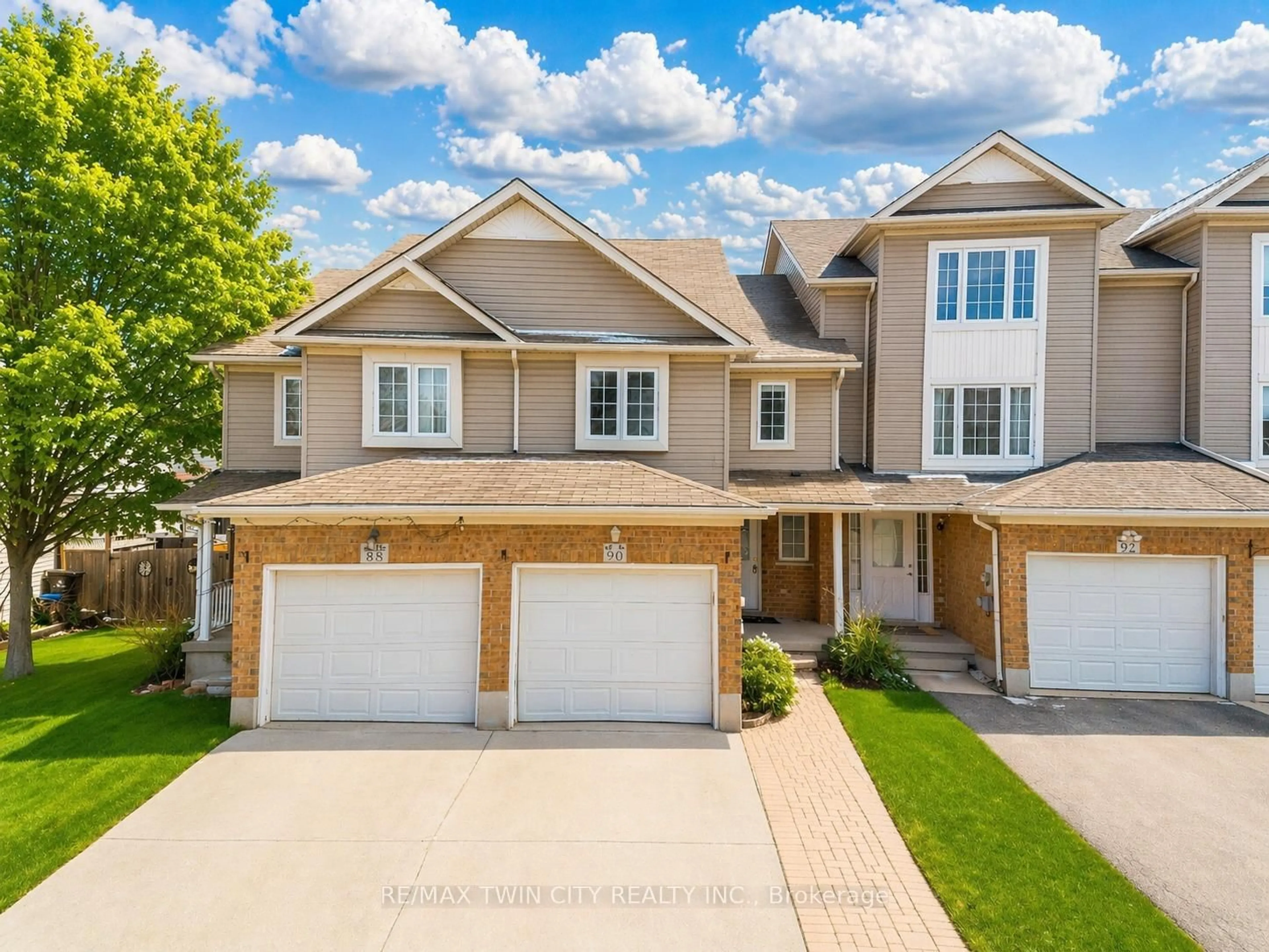 Home with brick exterior material, street for 90 Donnenwerth Dr, Kitchener Ontario N2E 4C9