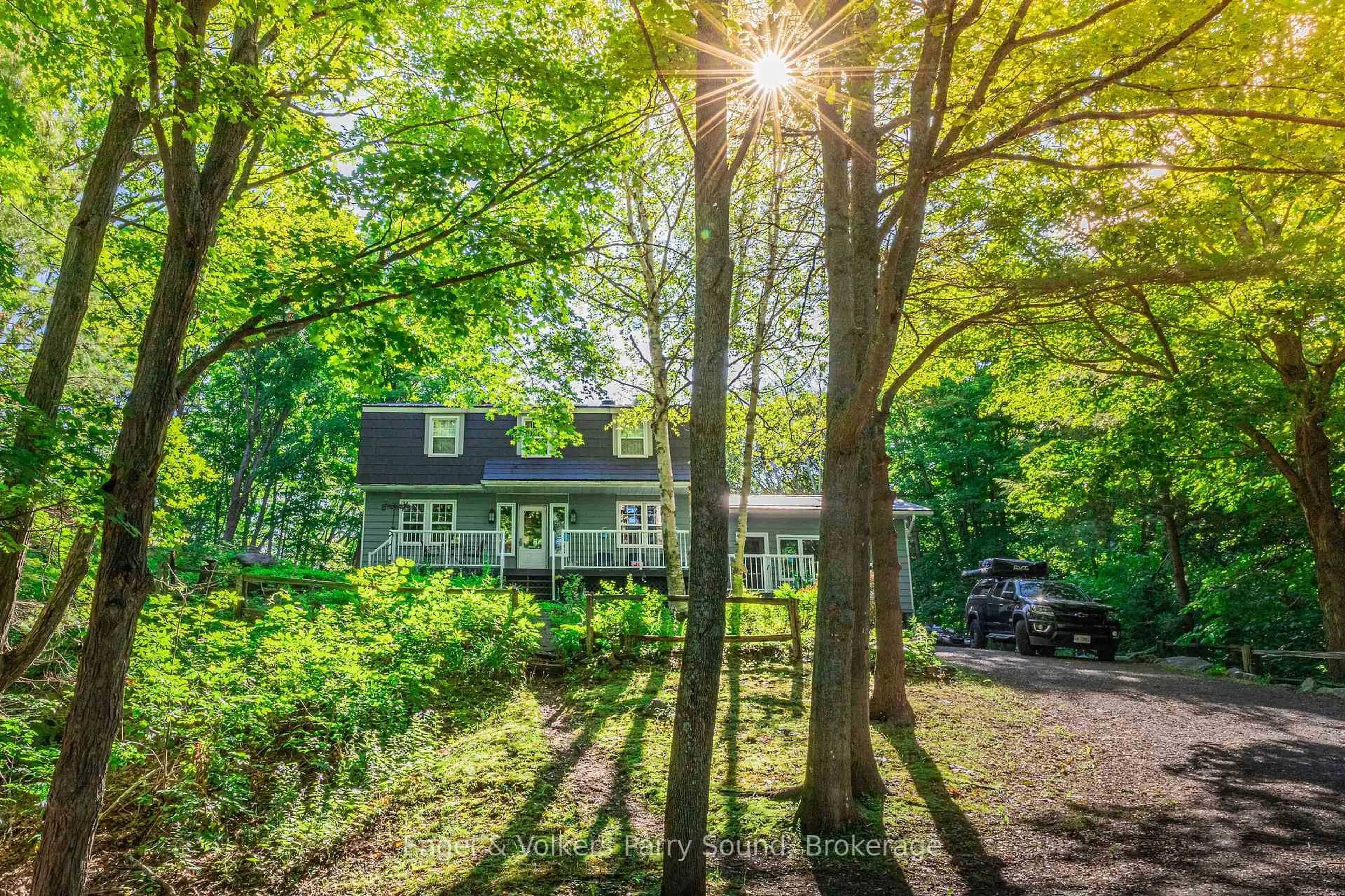 A pic from outside/outdoor area/front of a property/back of a property/a pic from drone, forest/trees view for 6 Harmony Lane, Parry Sound Ontario P2A 0B1