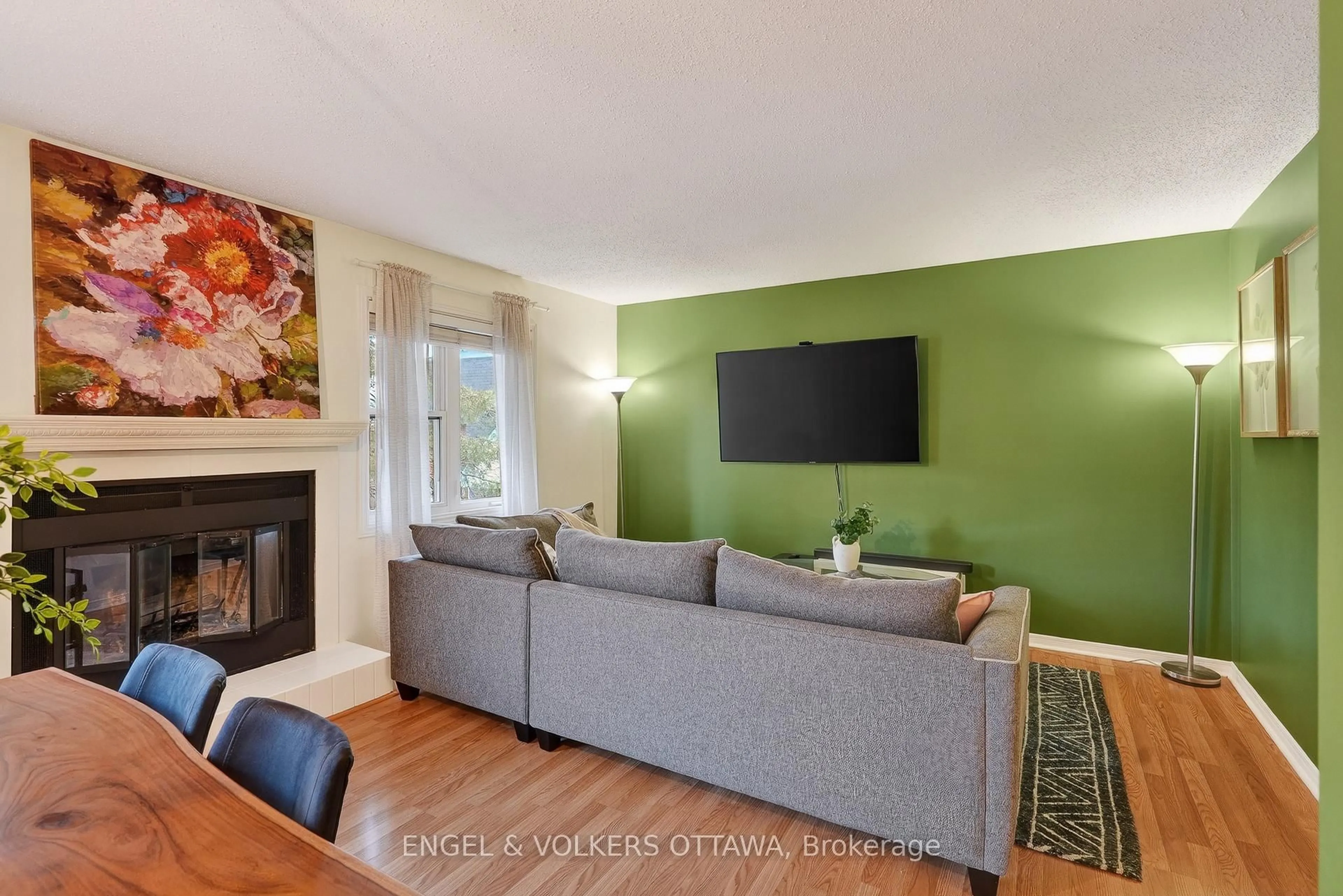 Living room with furniture, wood/laminate floor for 6 Terrace Dr #208, Ottawa Ontario K2H 9J2