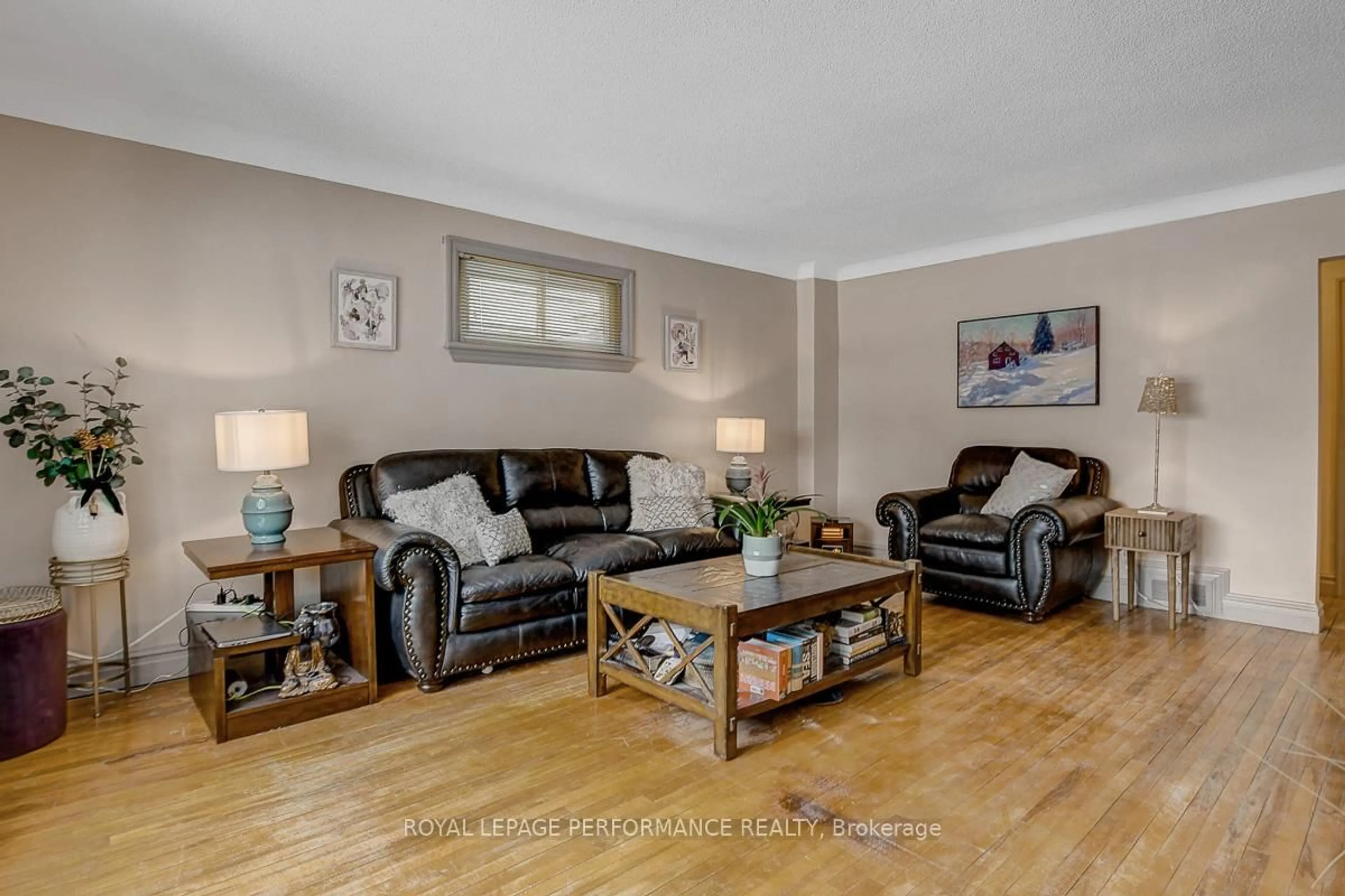 Living room with furniture, wood/laminate floor for 103 Glynn Ave, Ottawa Ontario K1K 1S7