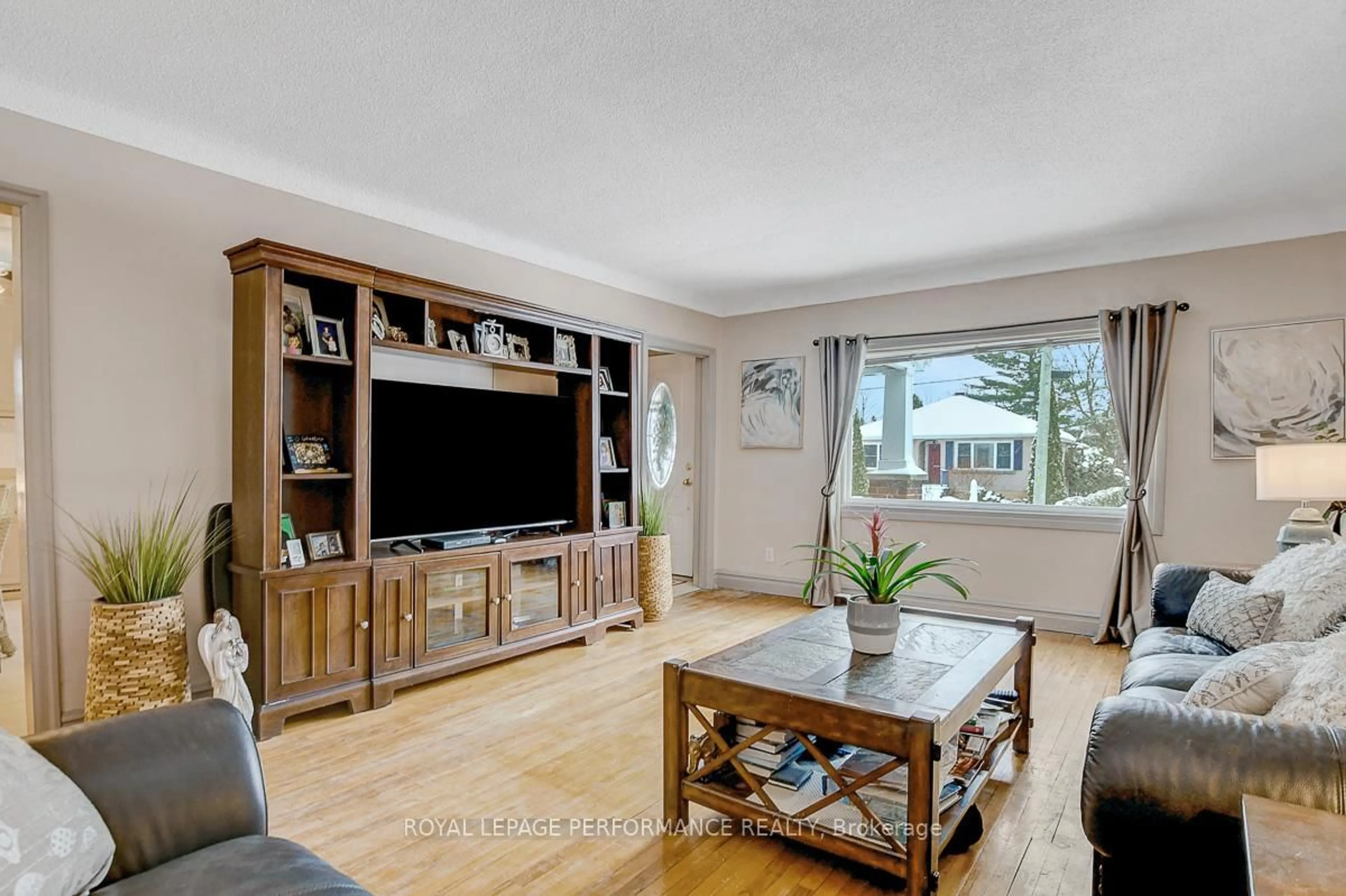 Living room with furniture, wood/laminate floor for 103 Glynn Ave, Ottawa Ontario K1K 1S7