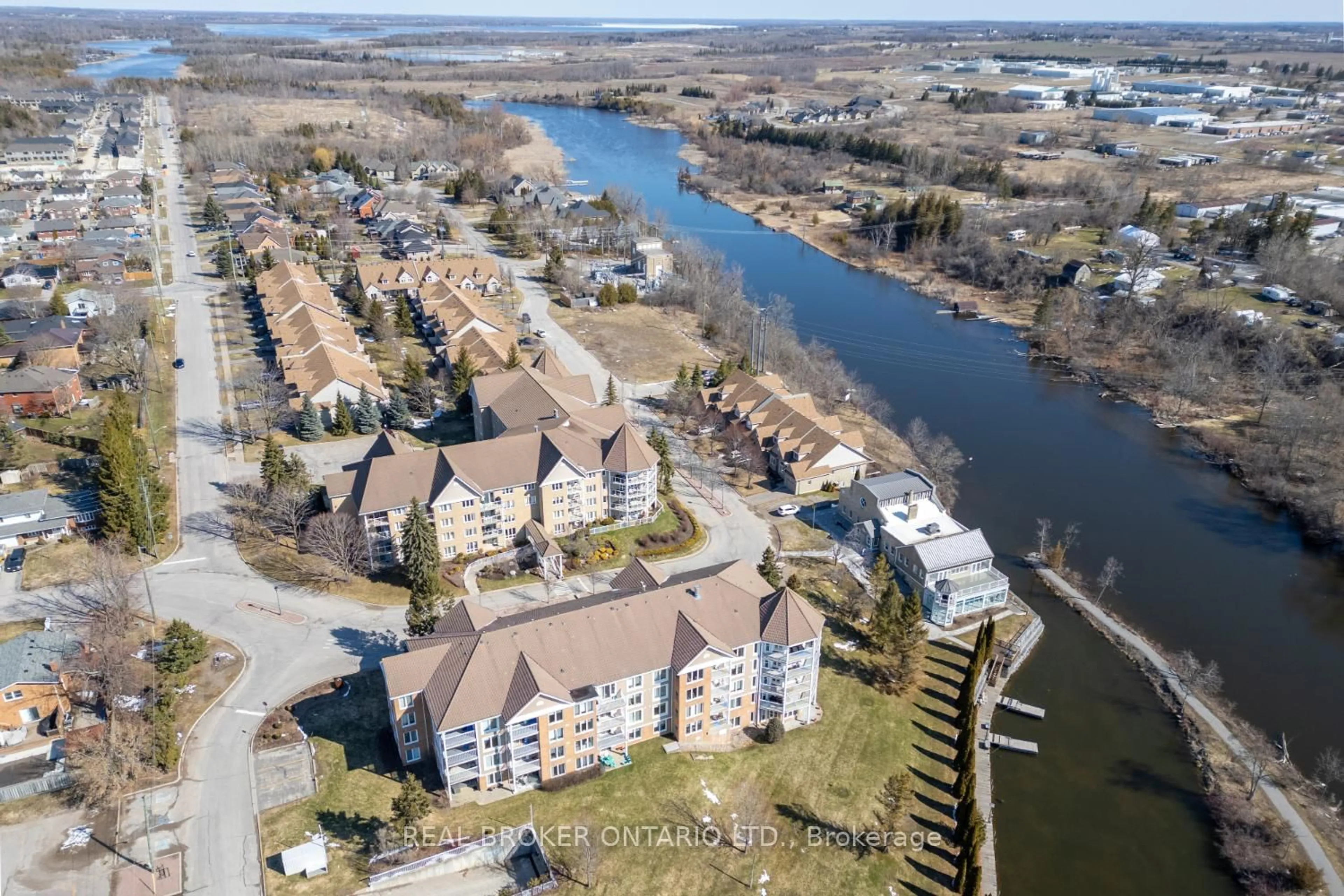 A pic from outside/outdoor area/front of a property/back of a property/a pic from drone, water/lake/river/ocean view for 51 Rivermill Blvd #401, Kawartha Lakes Ontario K9V 6E8
