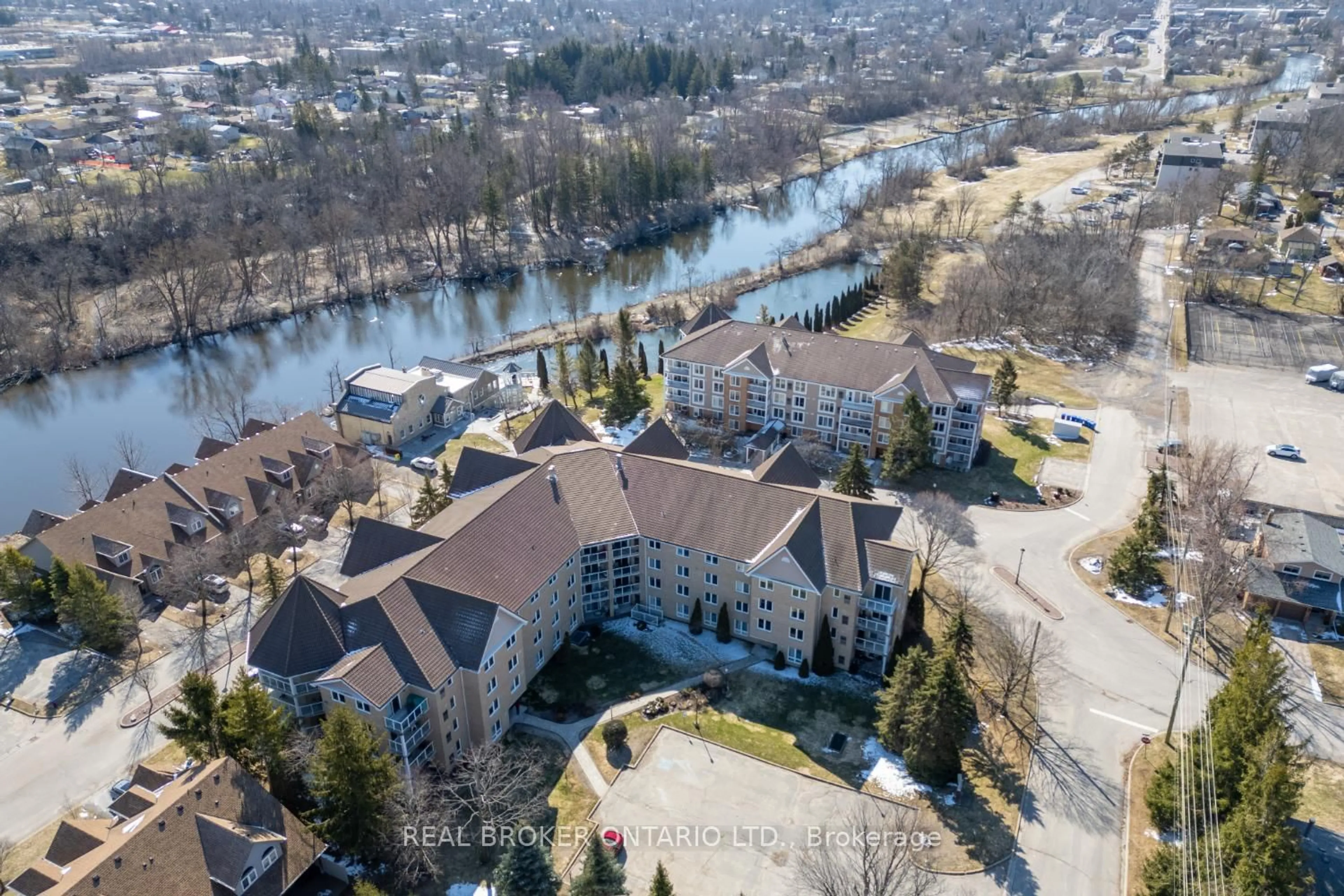 A pic from outside/outdoor area/front of a property/back of a property/a pic from drone, water/lake/river/ocean view for 51 Rivermill Blvd #401, Kawartha Lakes Ontario K9V 6E8