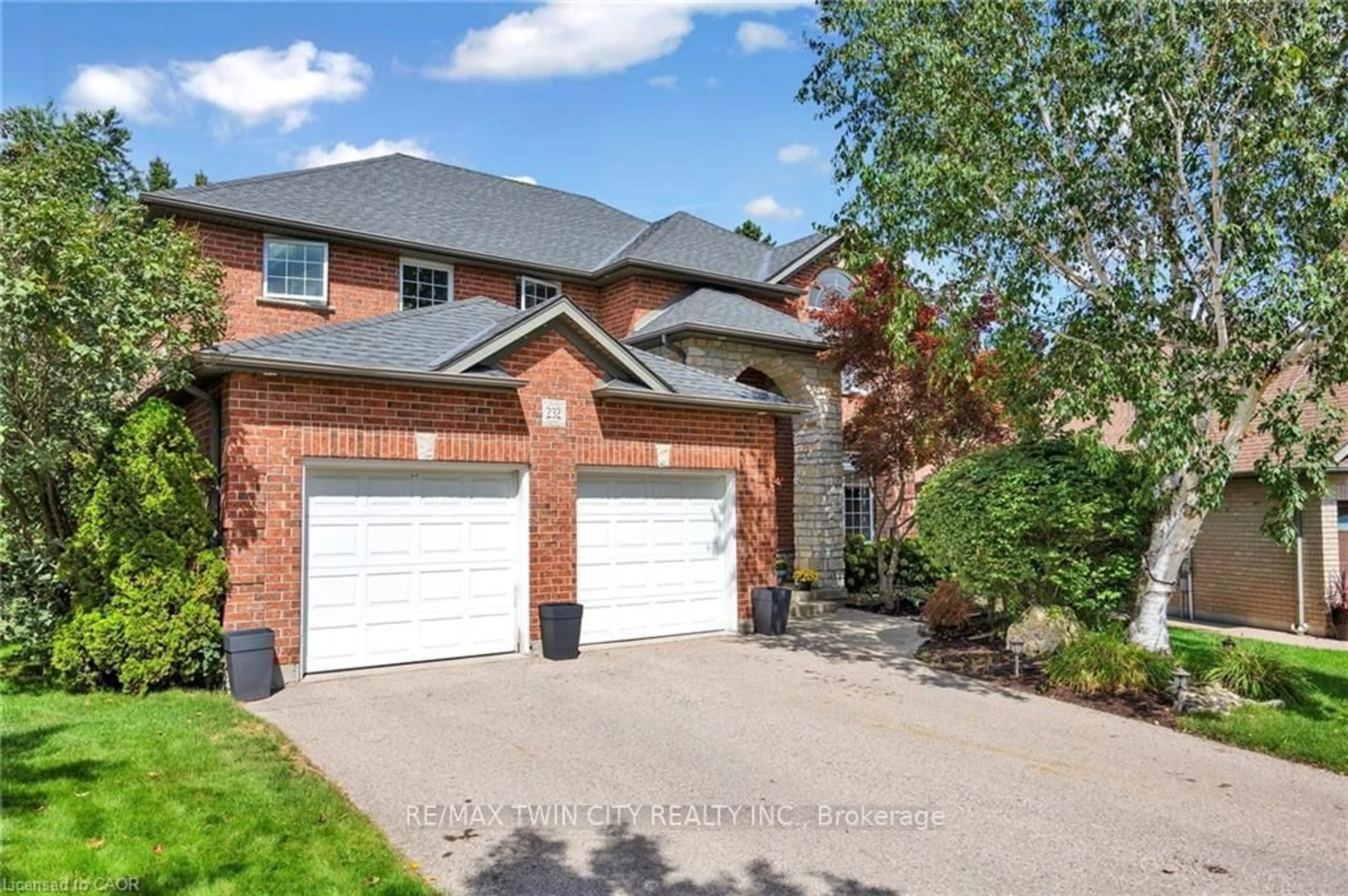 Home with brick exterior material, street for 232 The Lions Gate, Waterloo Ontario N2L 6M5