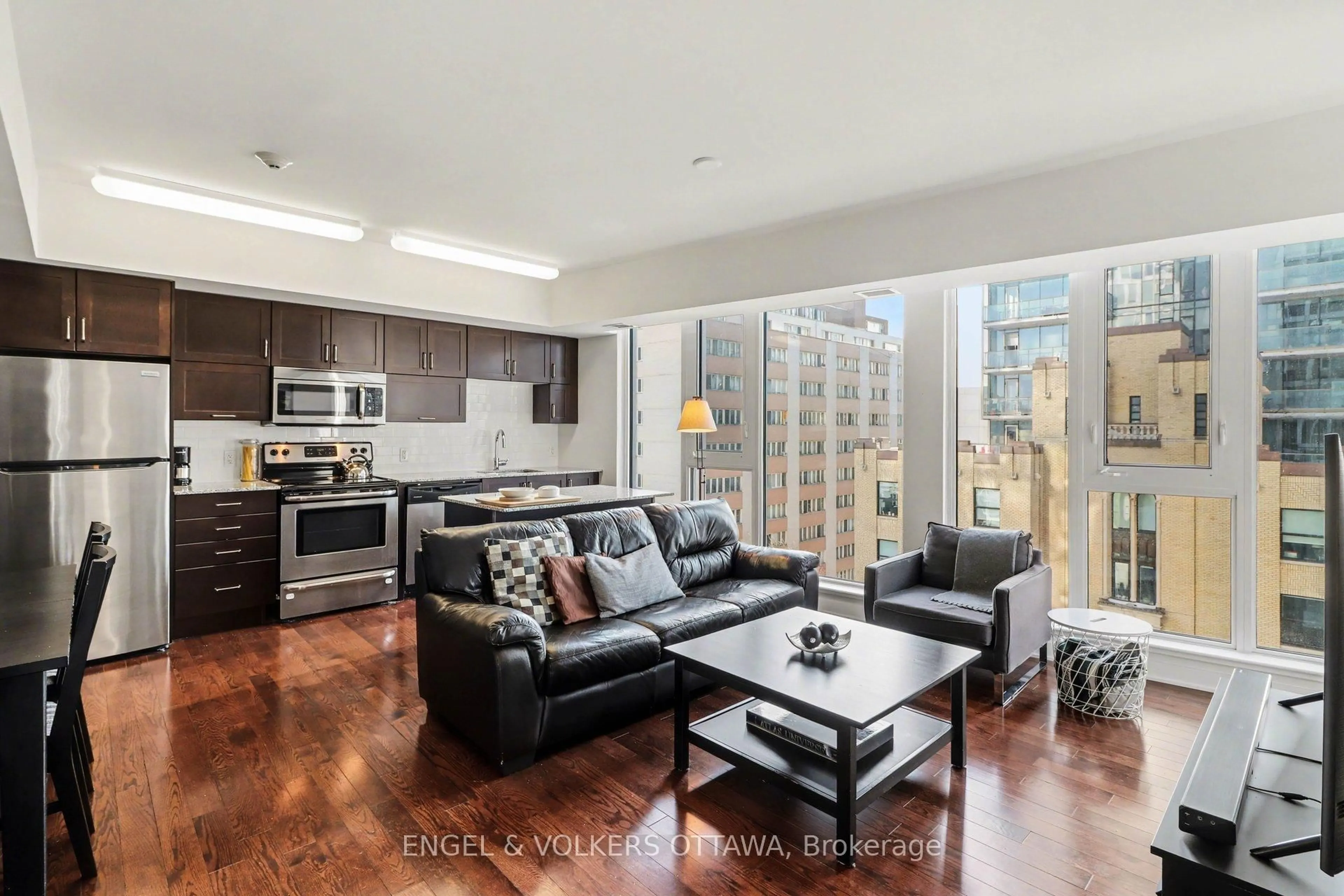 Living room with furniture, unknown for 179 Metcalfe St #701, Ottawa Ontario K2P 0W1