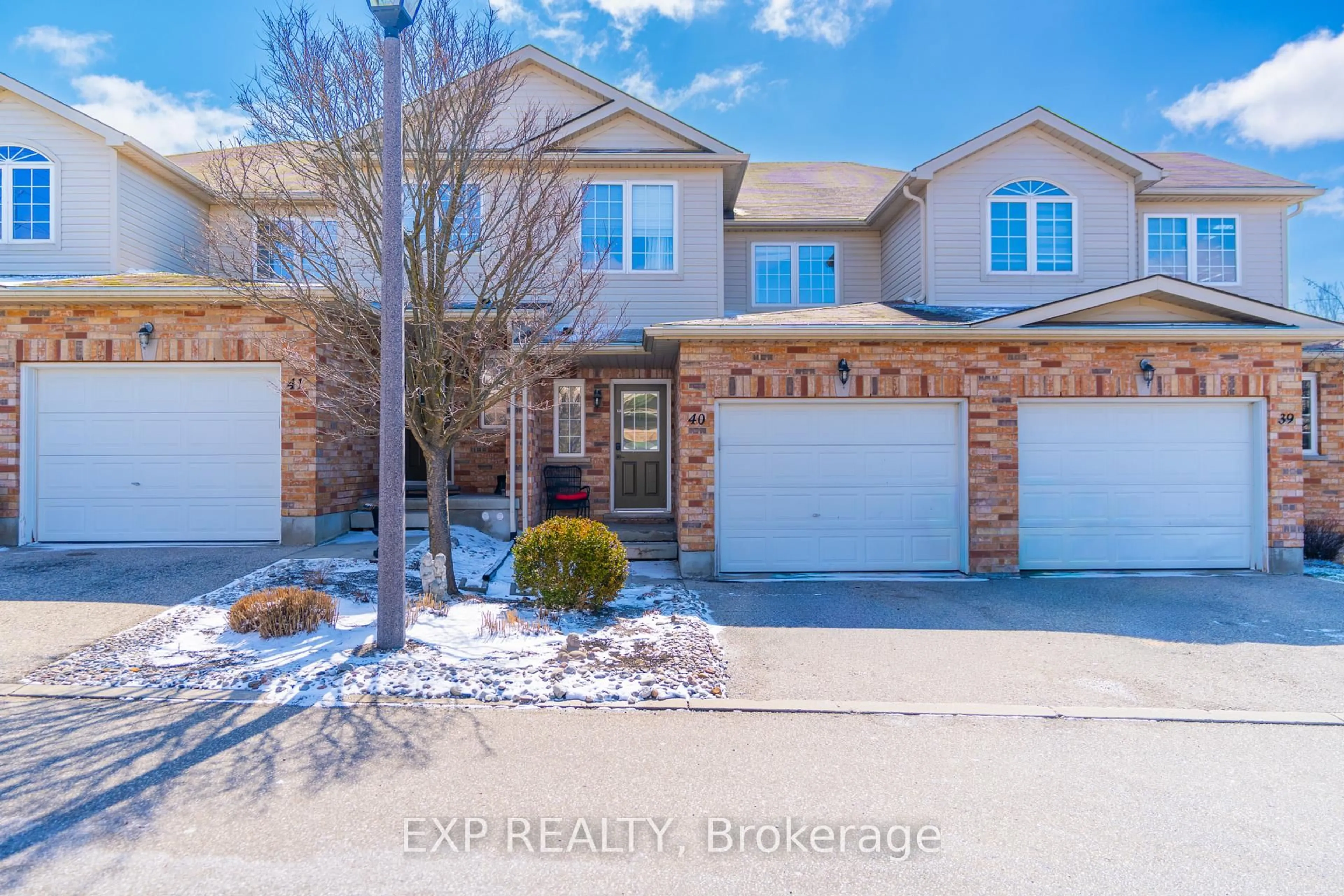 A pic from outside/outdoor area/front of a property/back of a property/a pic from drone, street for 105 Bard Blvd #40, Guelph Ontario N1L 0E2