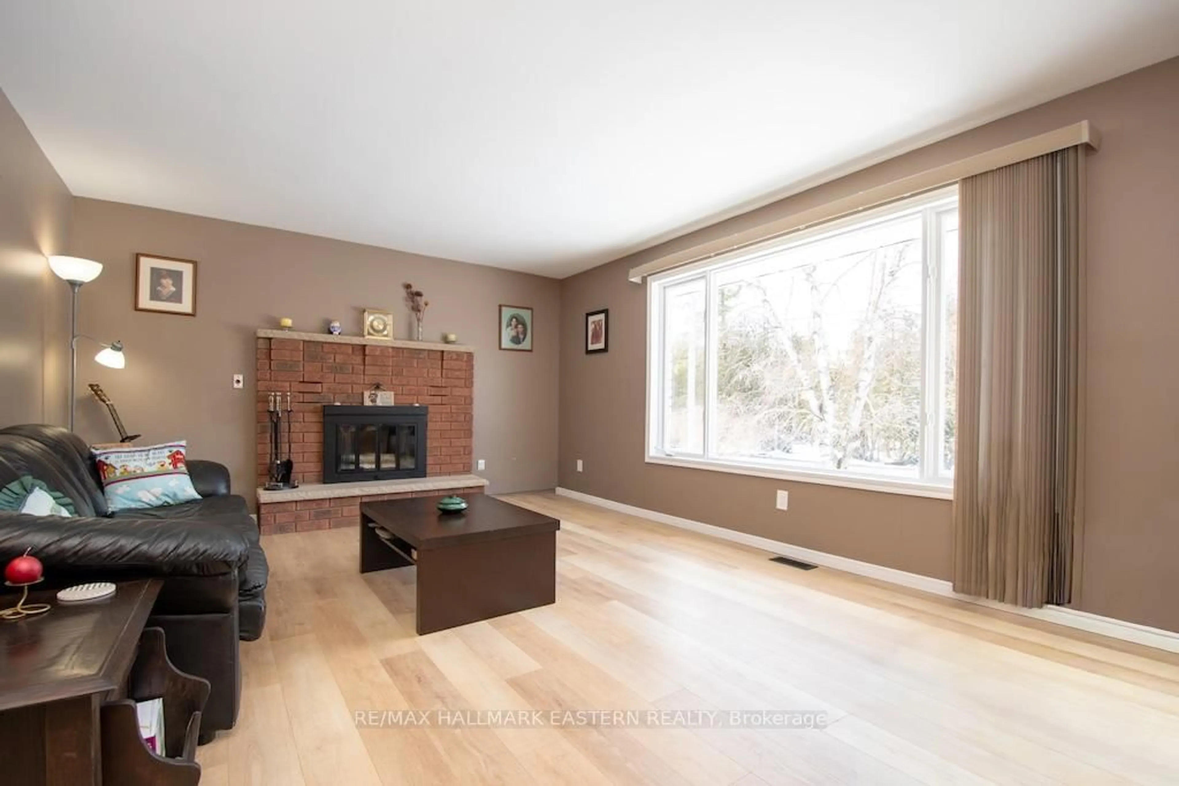 Living room with furniture, wood/laminate floor for 1079 Rock Rd, Douro-Dummer Ontario K0L 3A0