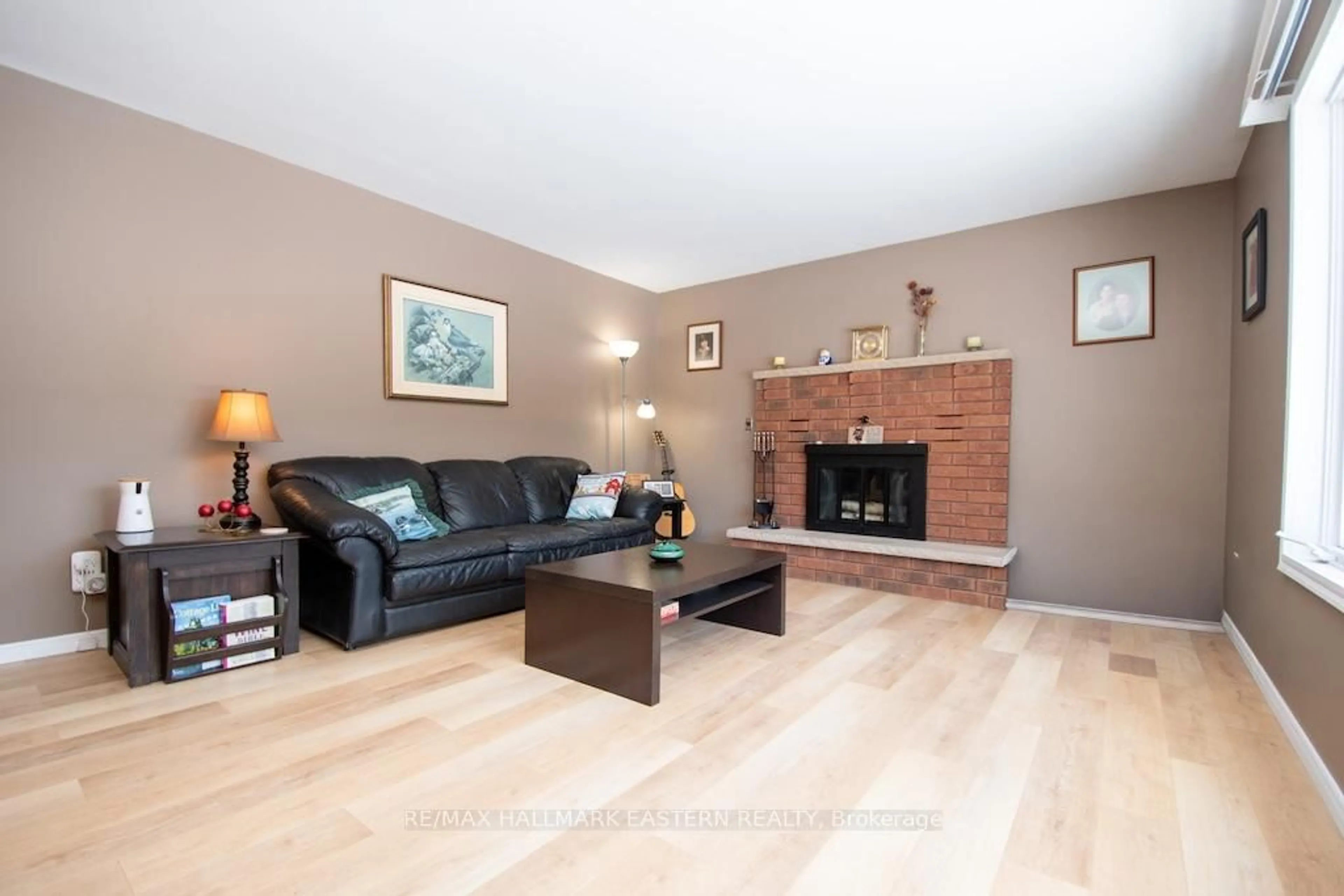 Living room with furniture, wood/laminate floor for 1079 Rock Rd, Douro-Dummer Ontario K0L 3A0