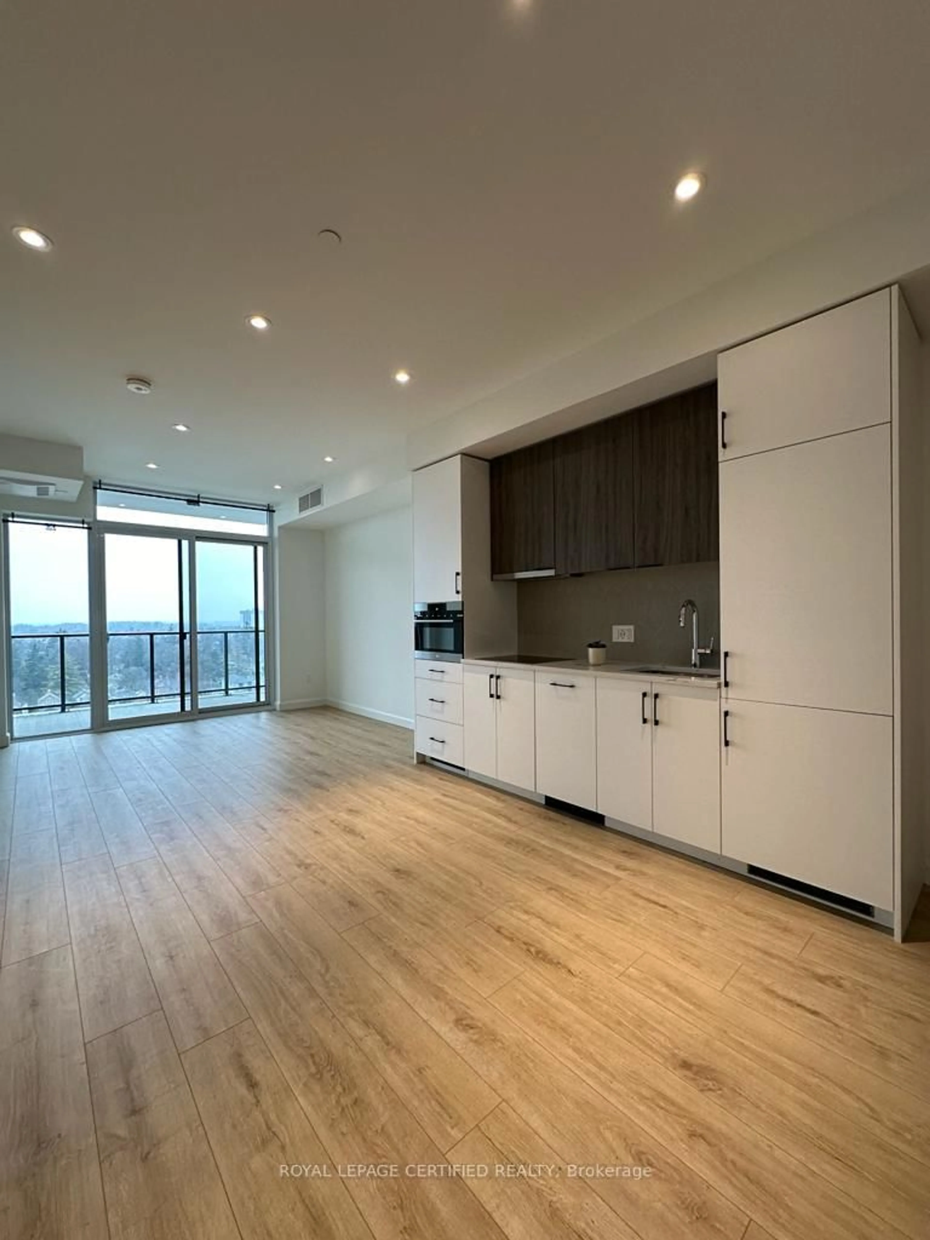 Open concept kitchen, wood/laminate floor for 741 King St #903, Kitchener Ontario N2G 1E5