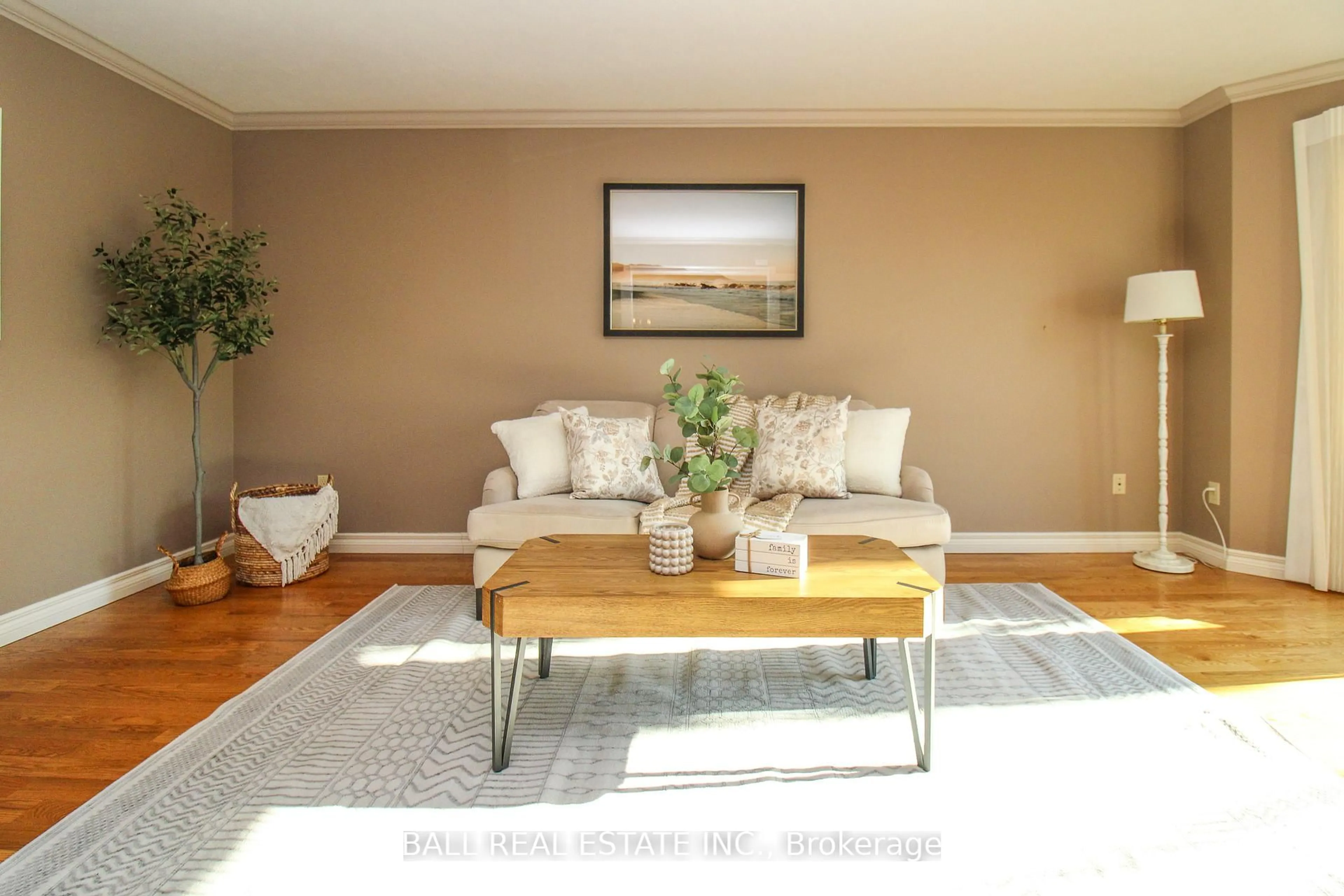 Living room with furniture, wood/laminate floor for 1166 Summit Dr, Peterborough Ontario K9J 8A7