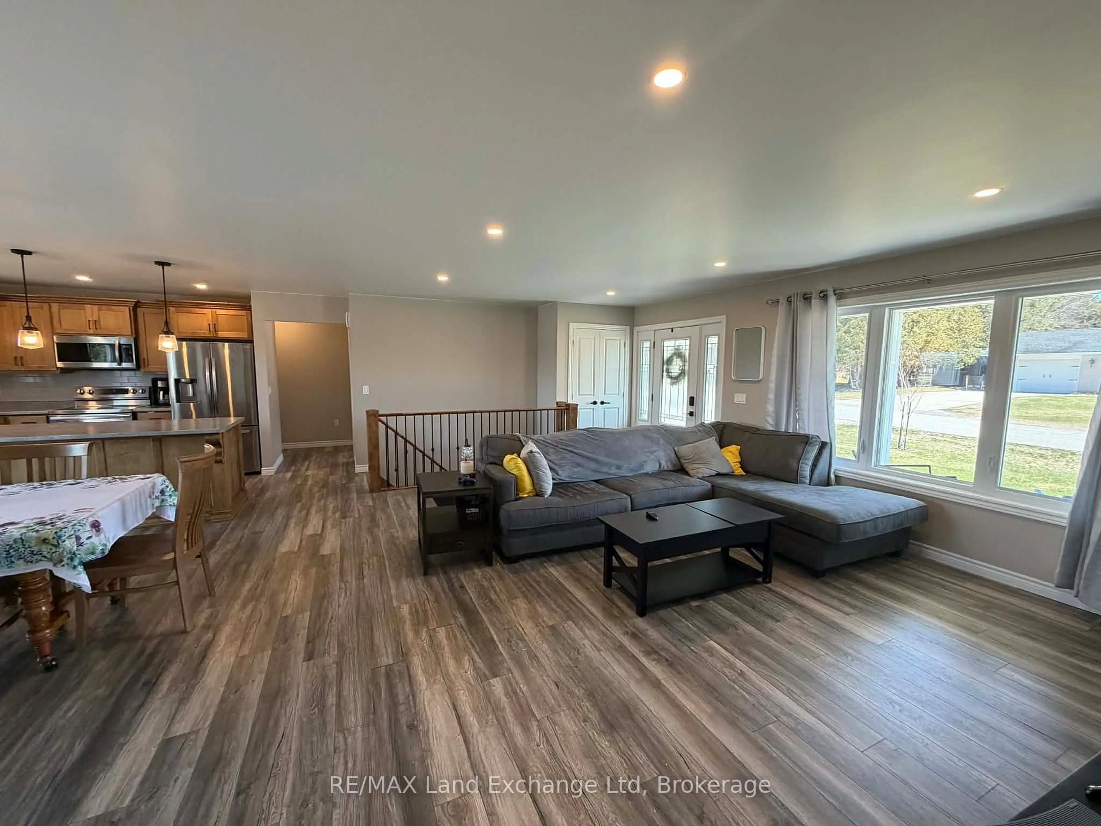 Living room with furniture, wood/laminate floor for 42 John St, Morris Turnberry Ontario N0G 1E0