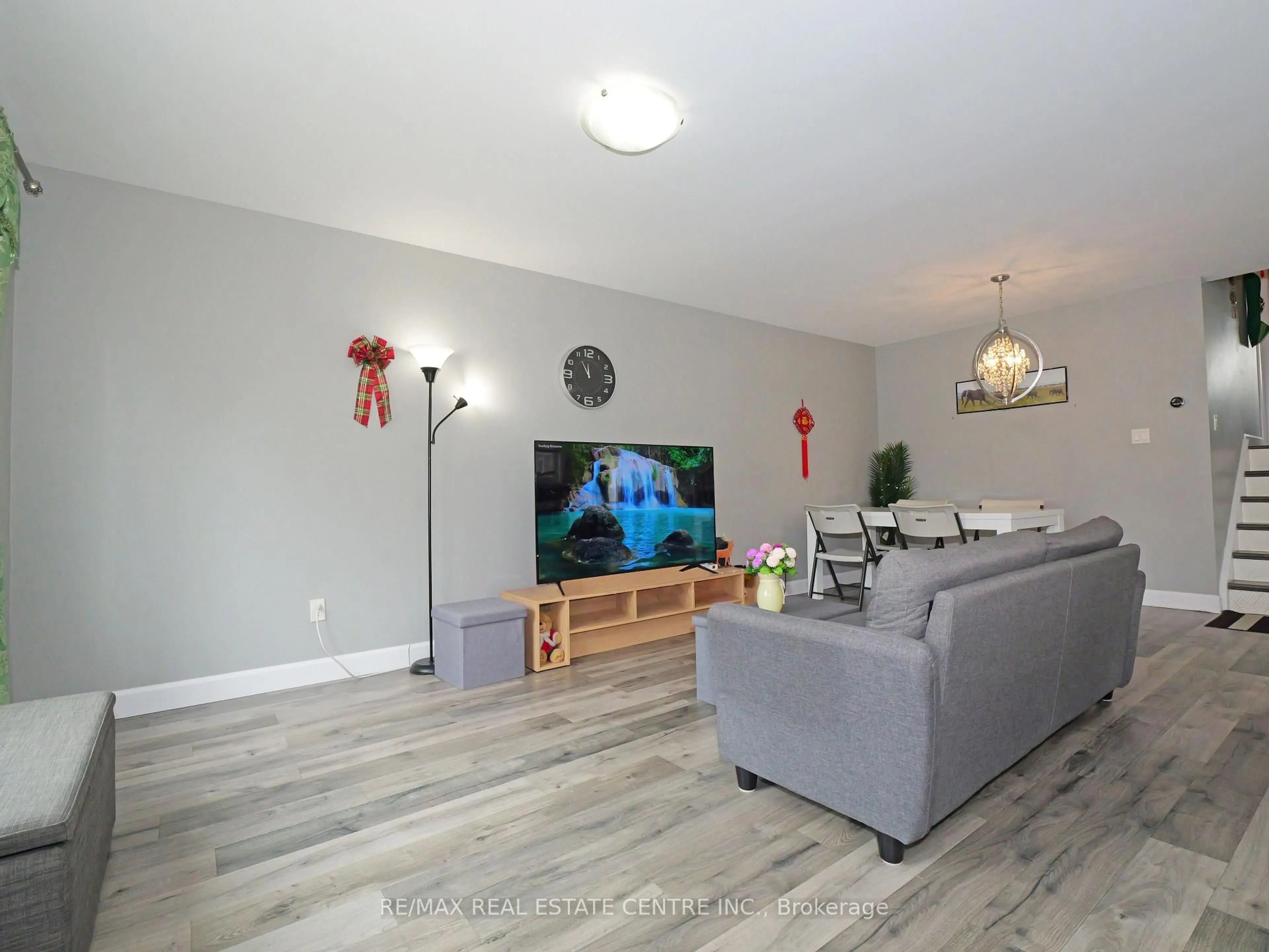 Living room with furniture, wood/laminate floor for 771 Monsarrat Ave, London East Ontario N5Y 4Y3