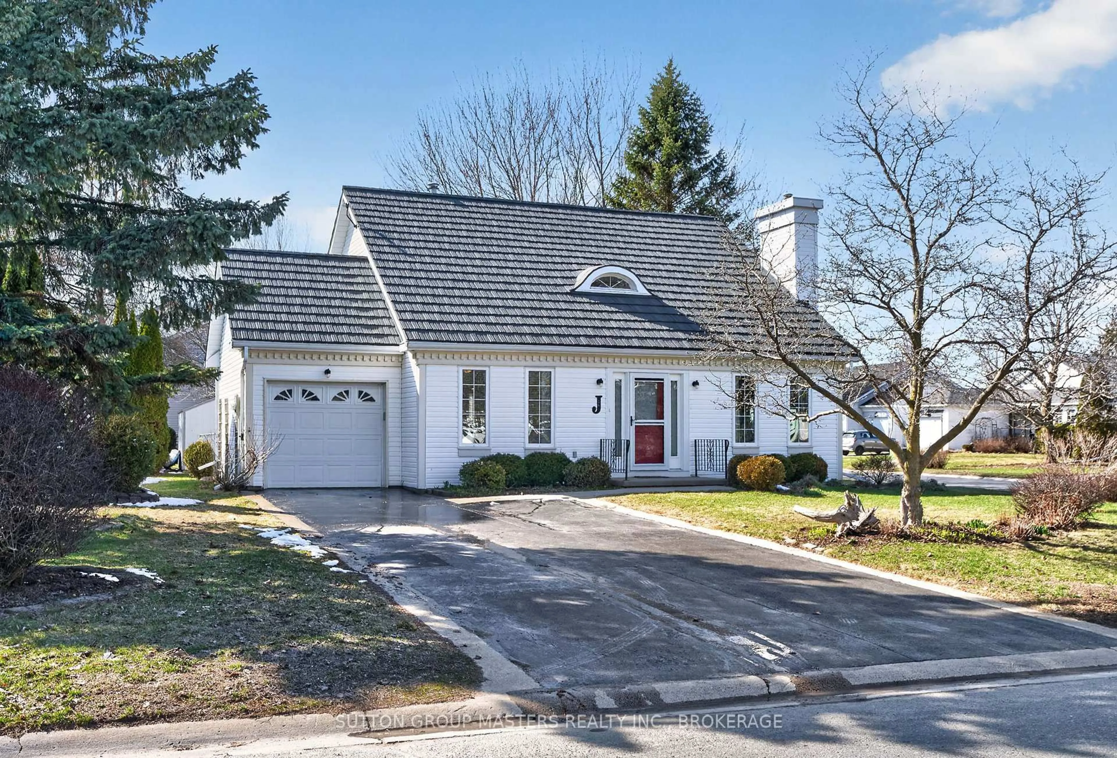 Home with vinyl exterior material, street for 16 Country Club Dr, Bath Ontario K0H 1G0