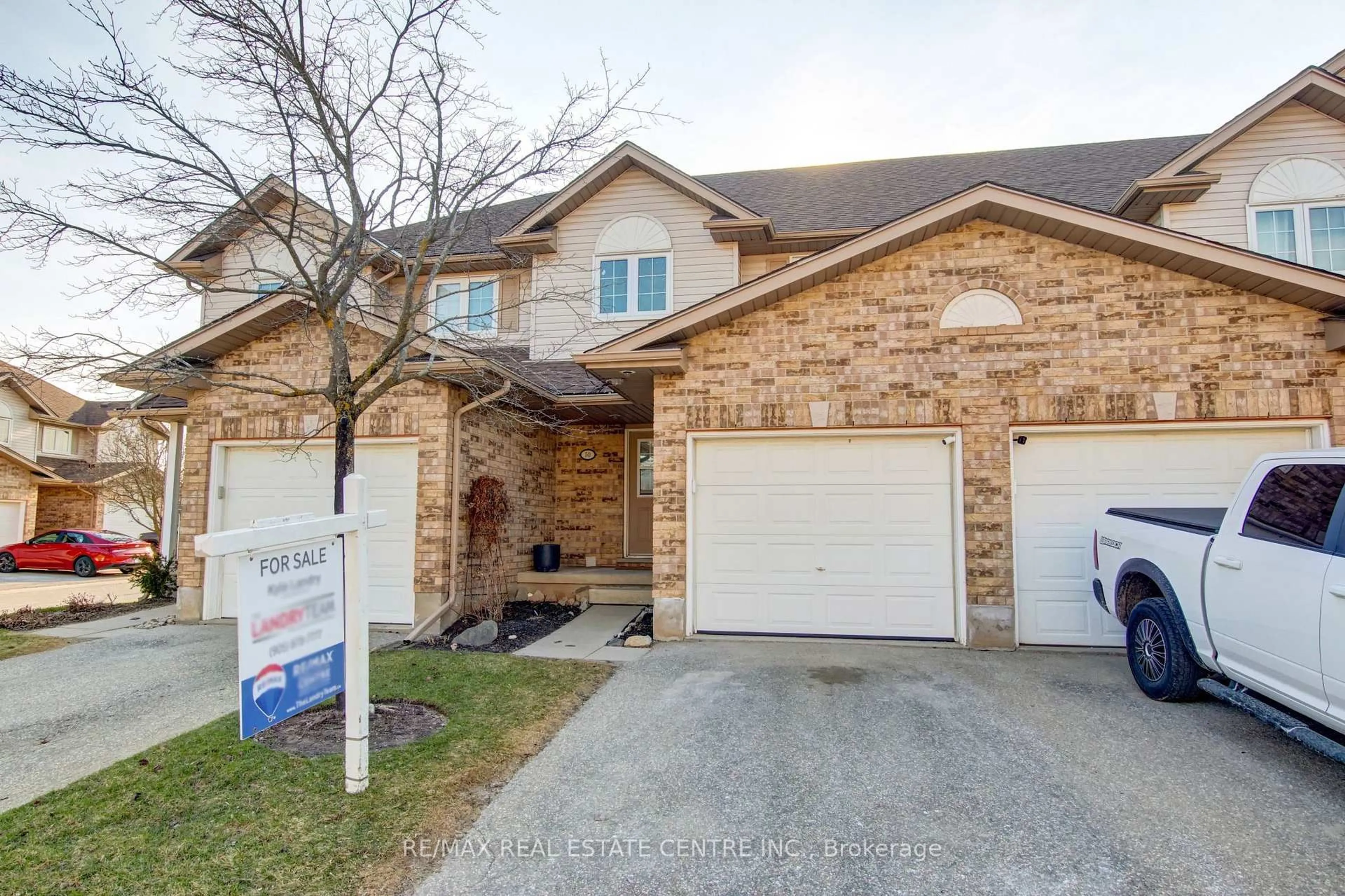 Home with brick exterior material, street for 31 Schroder Cres #50, Guelph Ontario N1E 7M6