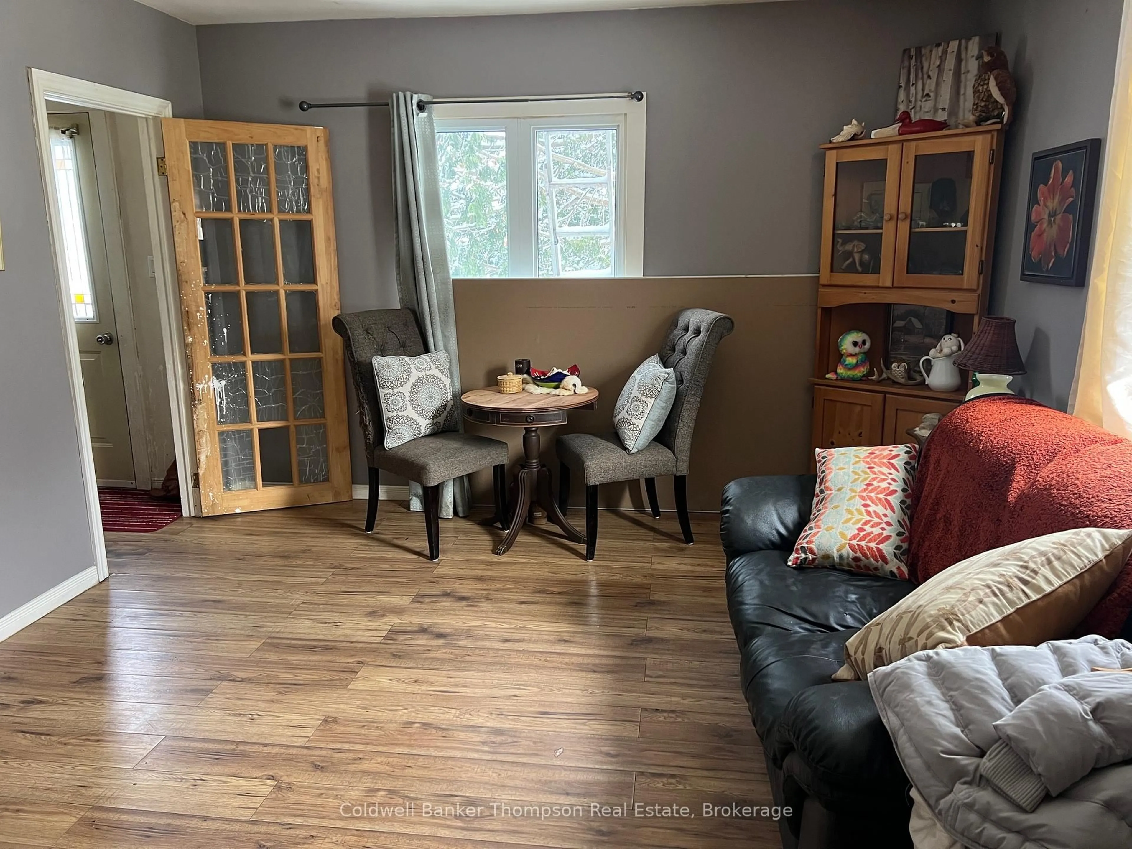 Living room with furniture, wood/laminate floor for 157 Ottawa Ave, Machar Ontario P0A 1X0