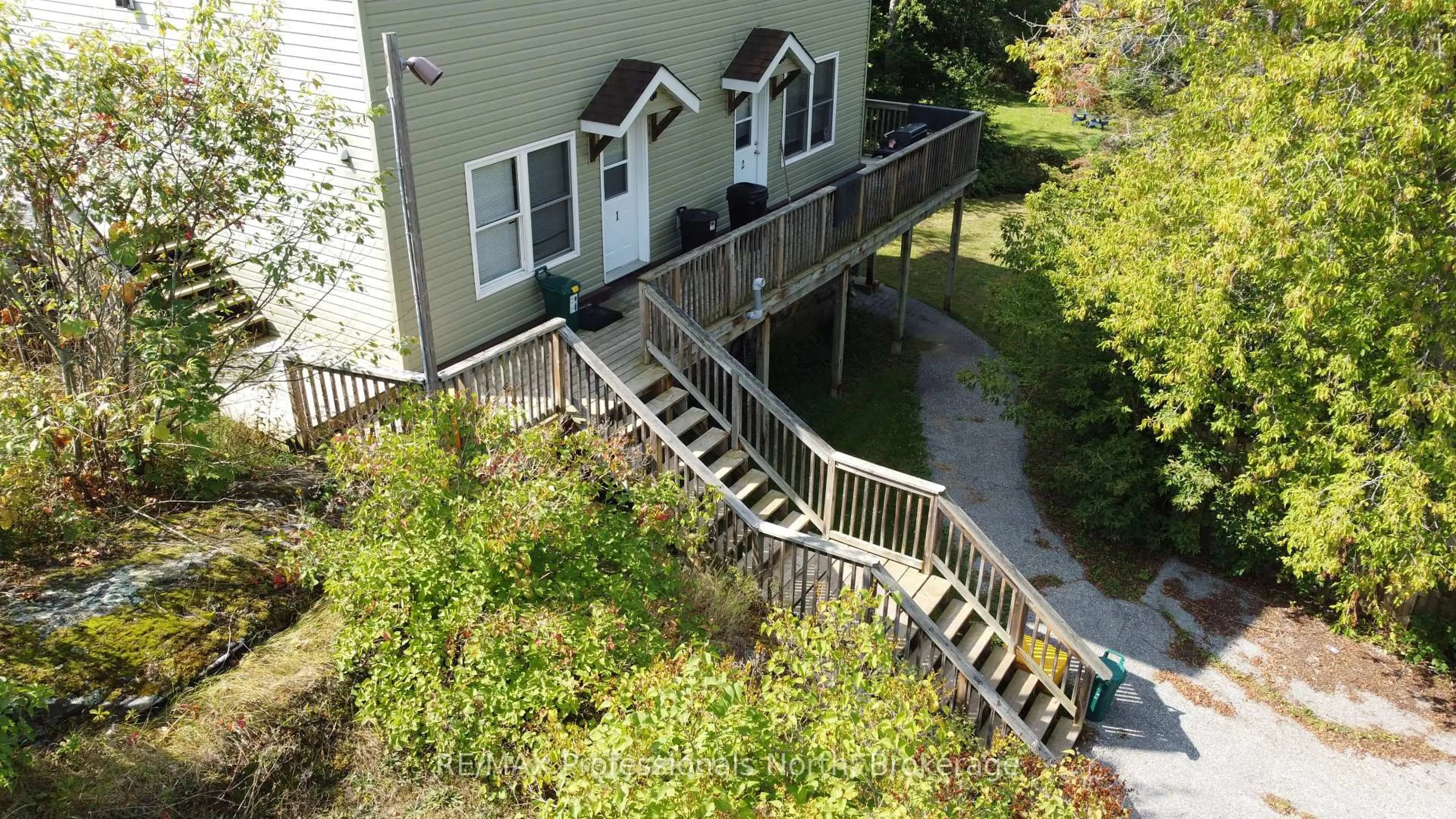 A pic from outside/outdoor area/front of a property/back of a property/a pic from drone, unknown for 9 WEST Rd, Huntsville Ontario P1H 1K9