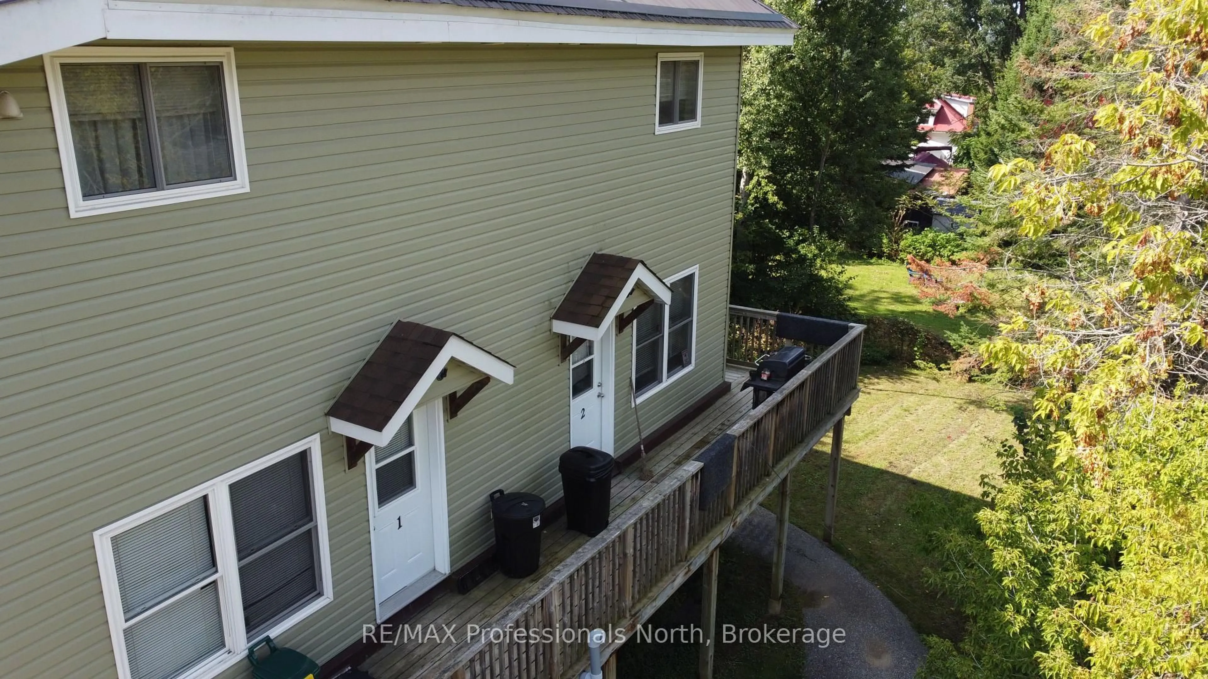 A pic from outside/outdoor area/front of a property/back of a property/a pic from drone, city buildings view from balcony for 9 WEST Rd, Huntsville Ontario P1H 1K9