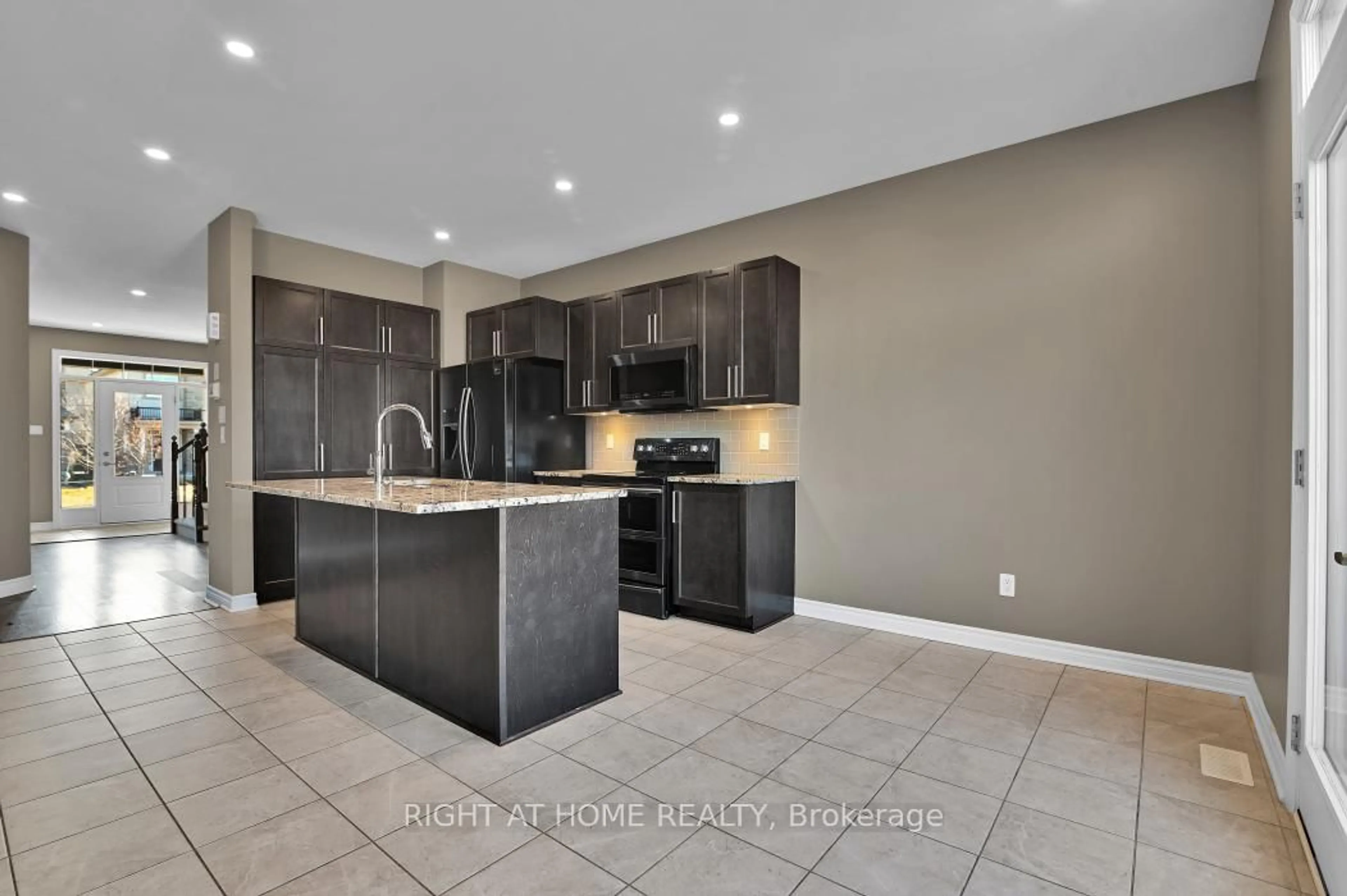 Open concept kitchen, ceramic/tile floor for 213 Esturgeon St, Ottawa Ontario K4A 1G3