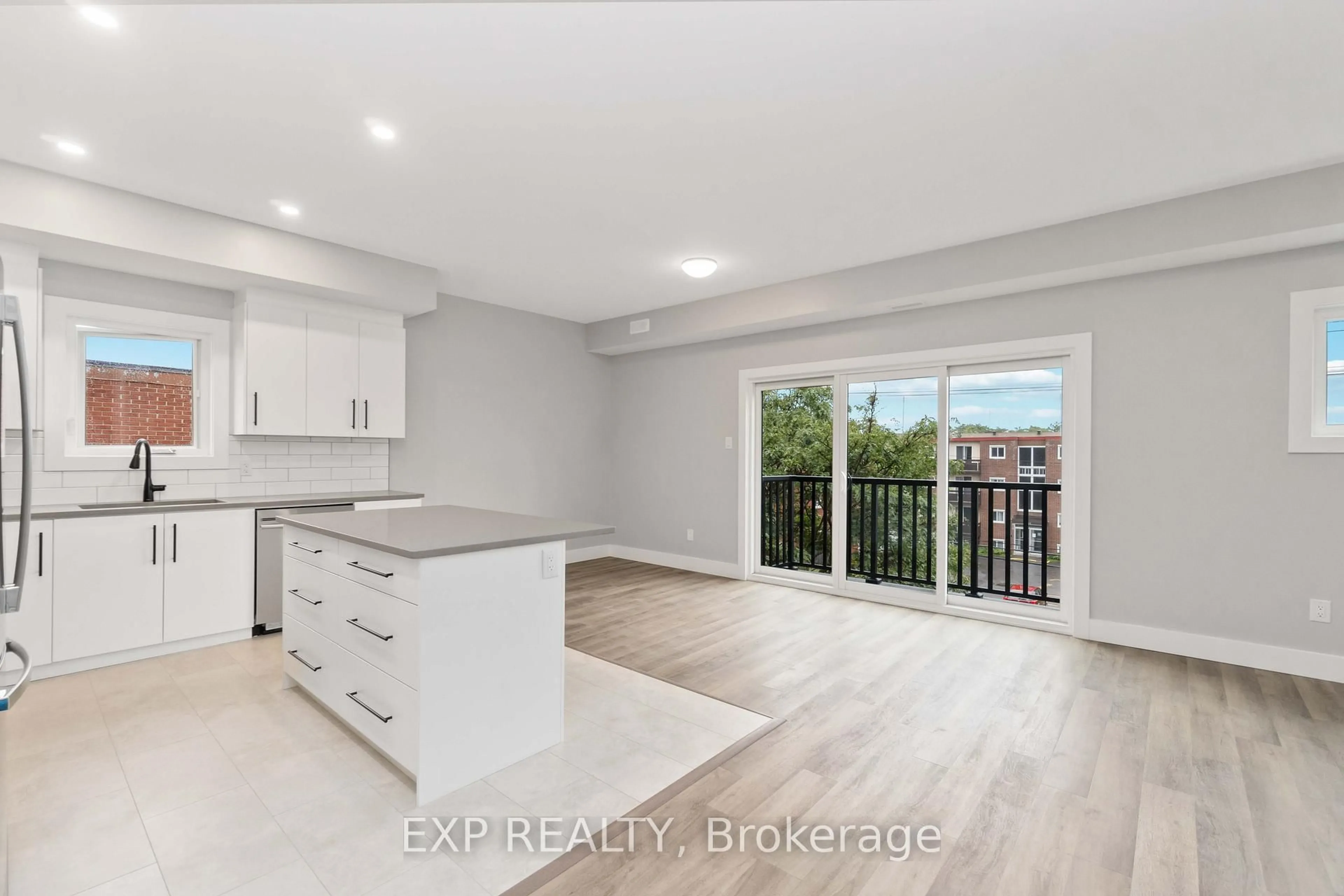 Open concept kitchen, wood/laminate floor for 255 Presland Rd, Ottawa Ontario K1K 2B6