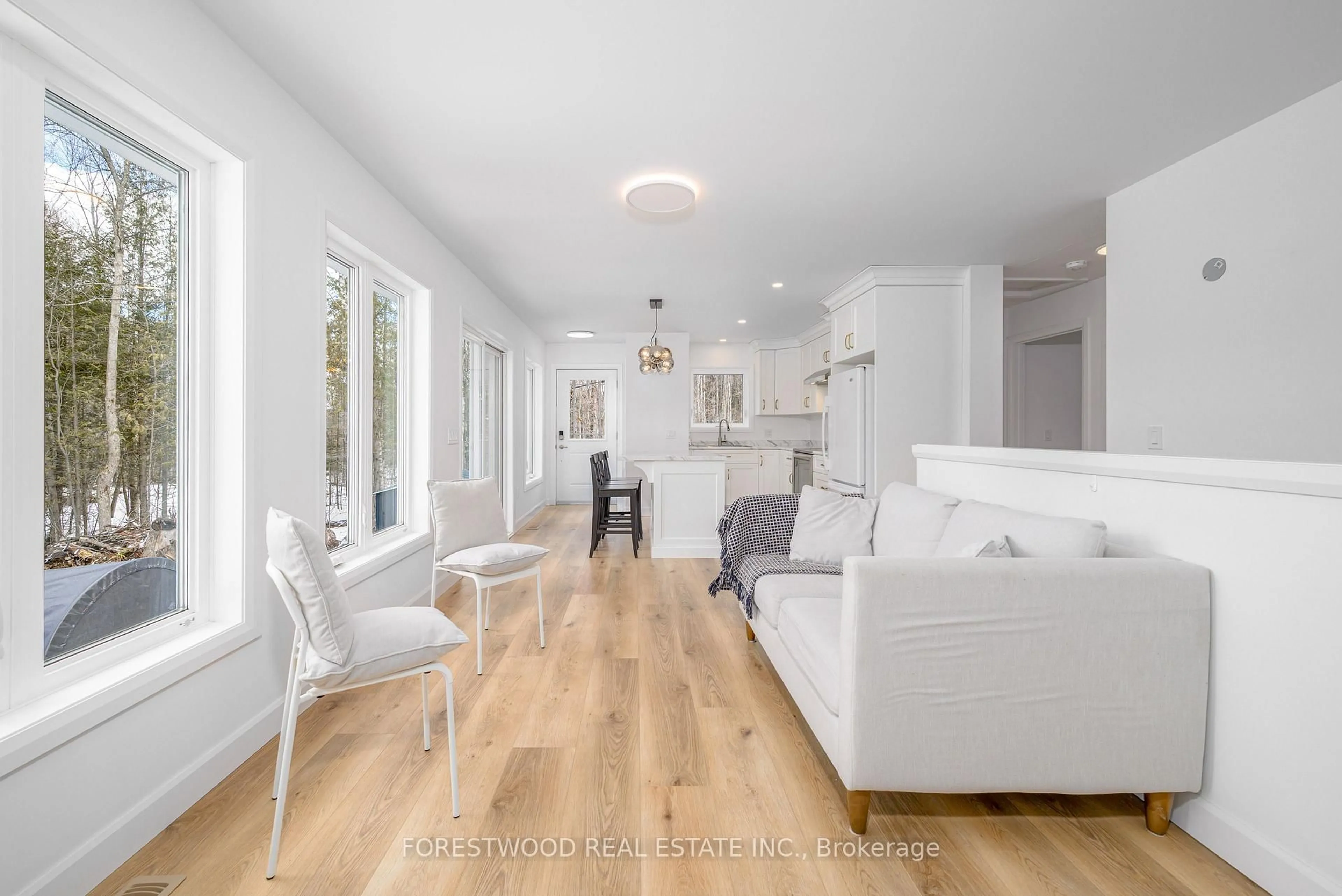 Living room with furniture, wood/laminate floor for 1150 Providence Dr, Algonquin Highlands Ontario K0M 1J1