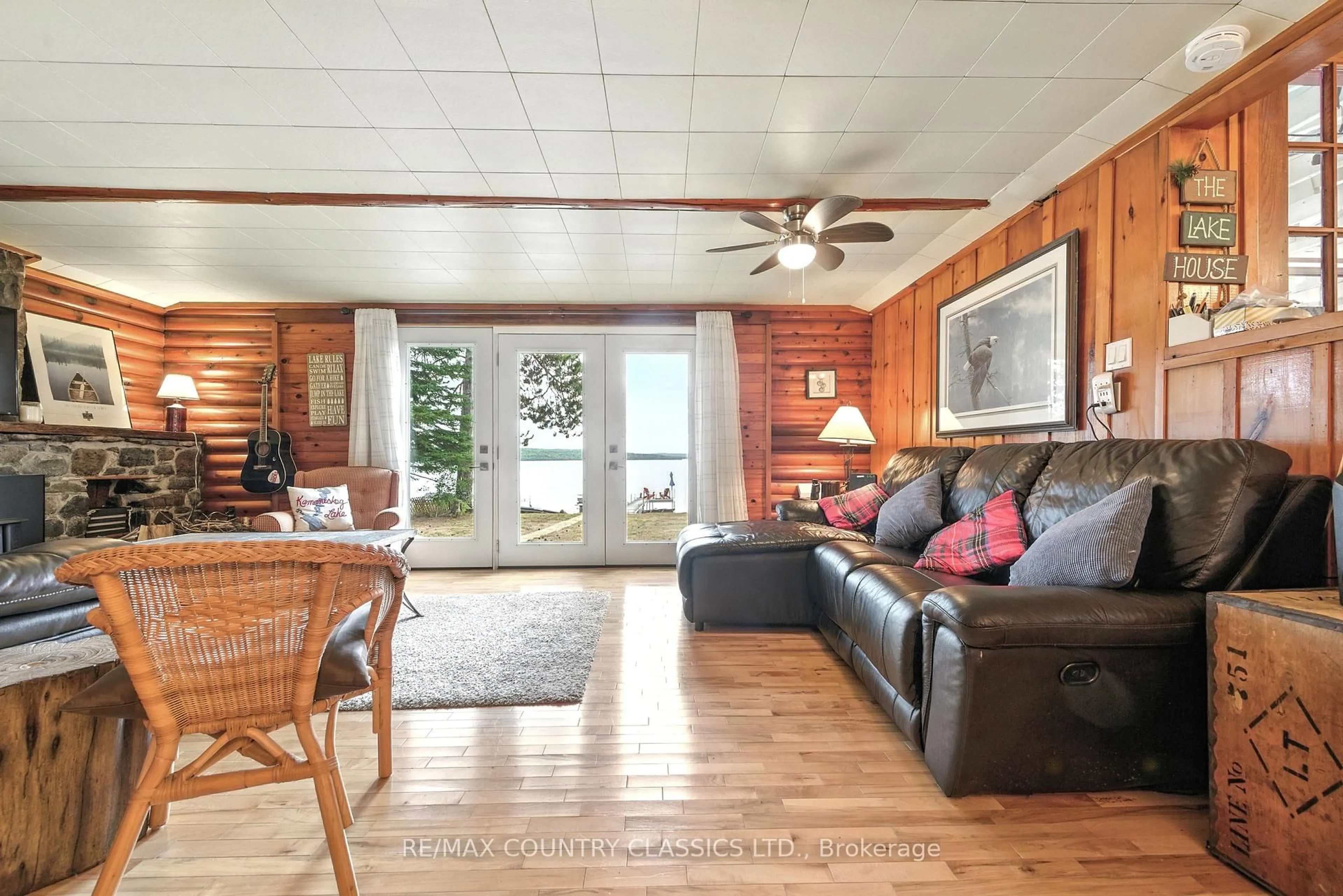 Living room with furniture, wood/laminate floor for 1258 Kamaniskeg Lake Rd, Combermere Ontario K0J 1L0