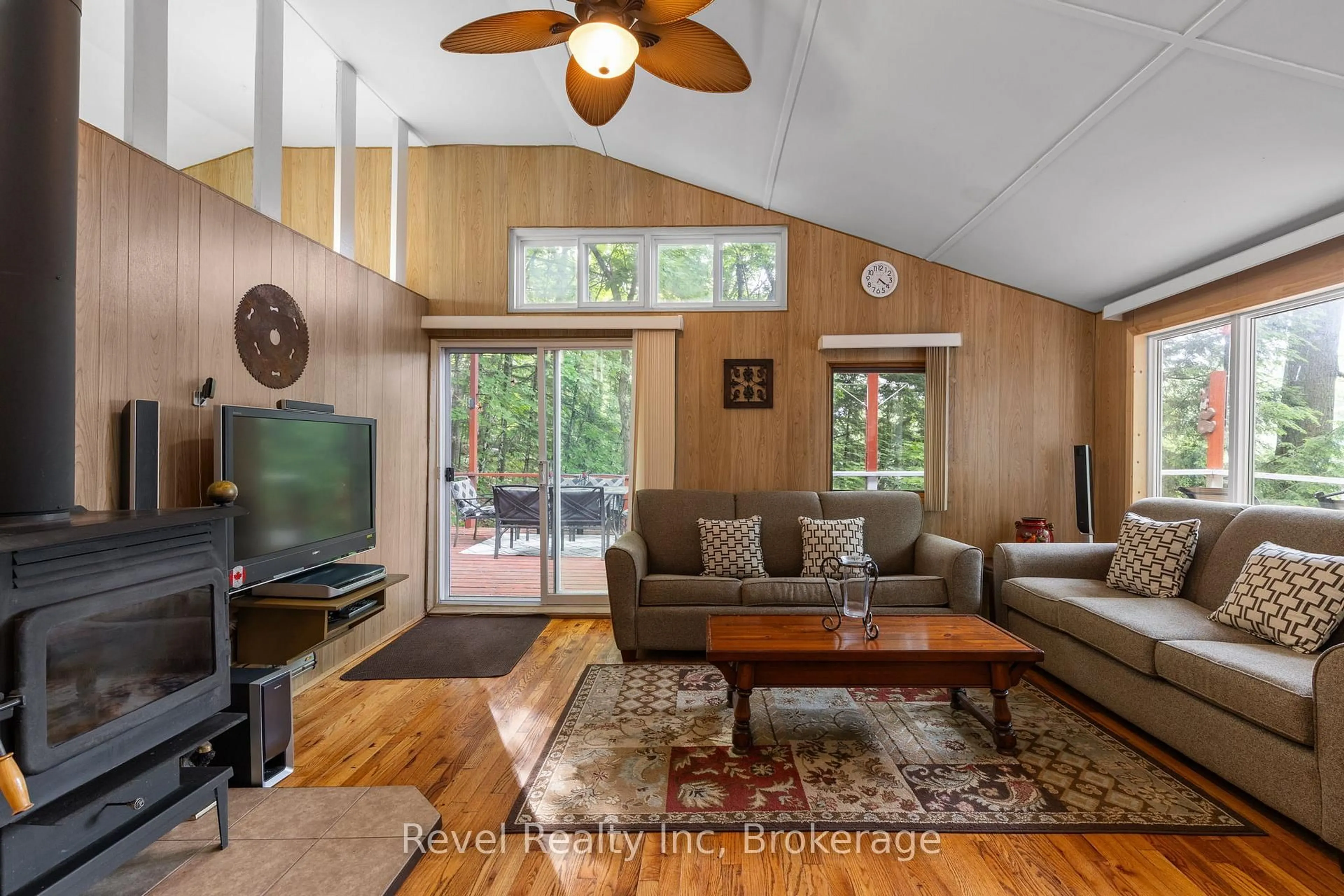 Living room with furniture, wood/laminate floor for 1096 Cowan Park Rd, Muskoka Lakes Ontario P0B 1M0