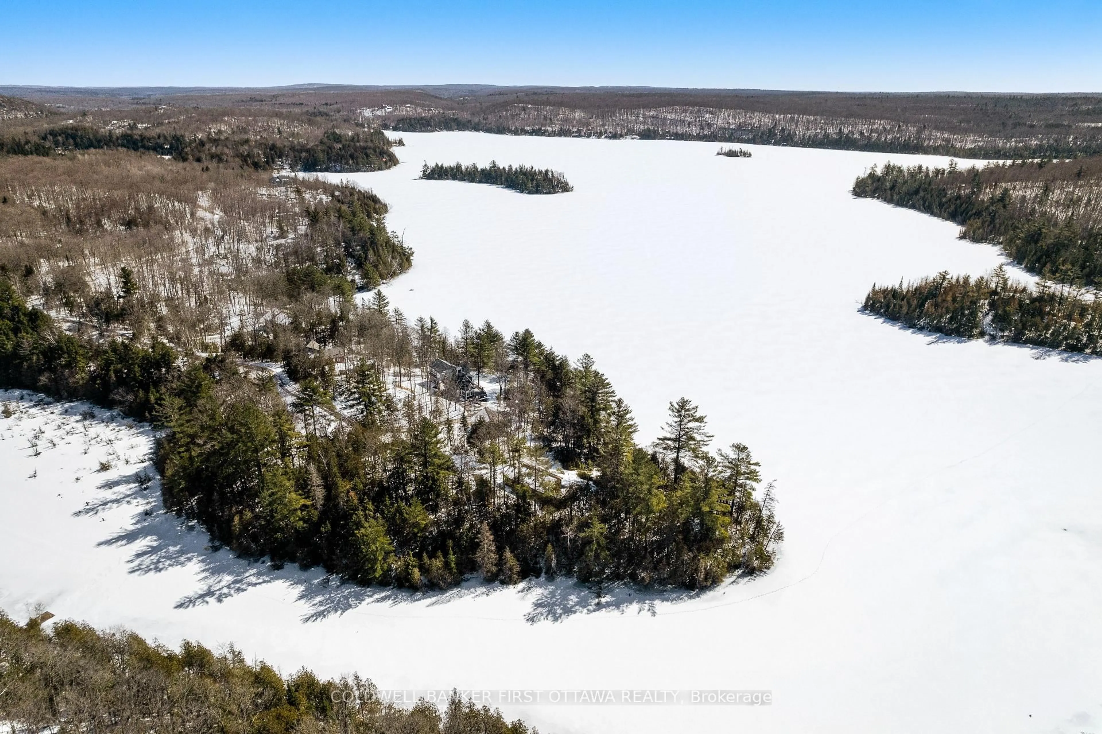 A pic from outside/outdoor area/front of a property/back of a property/a pic from drone, water/lake/river/ocean view for 1257 North Shore Estates Lane, Ompah Ontario K0H 2J0