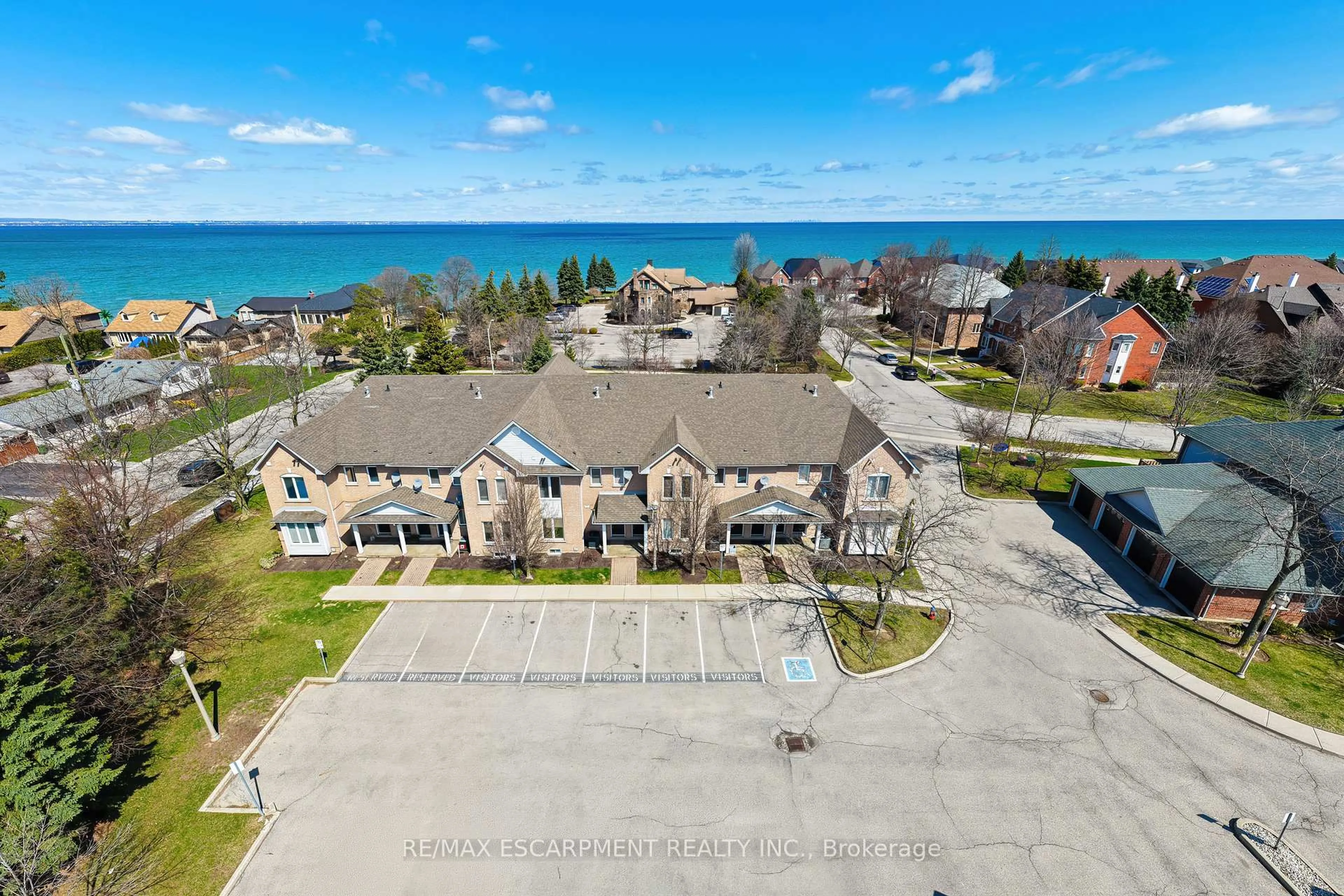 A pic from outside/outdoor area/front of a property/back of a property/a pic from drone, water/lake/river/ocean view for 2 Harbour Dr #14, Hamilton Ontario L8E 6B1