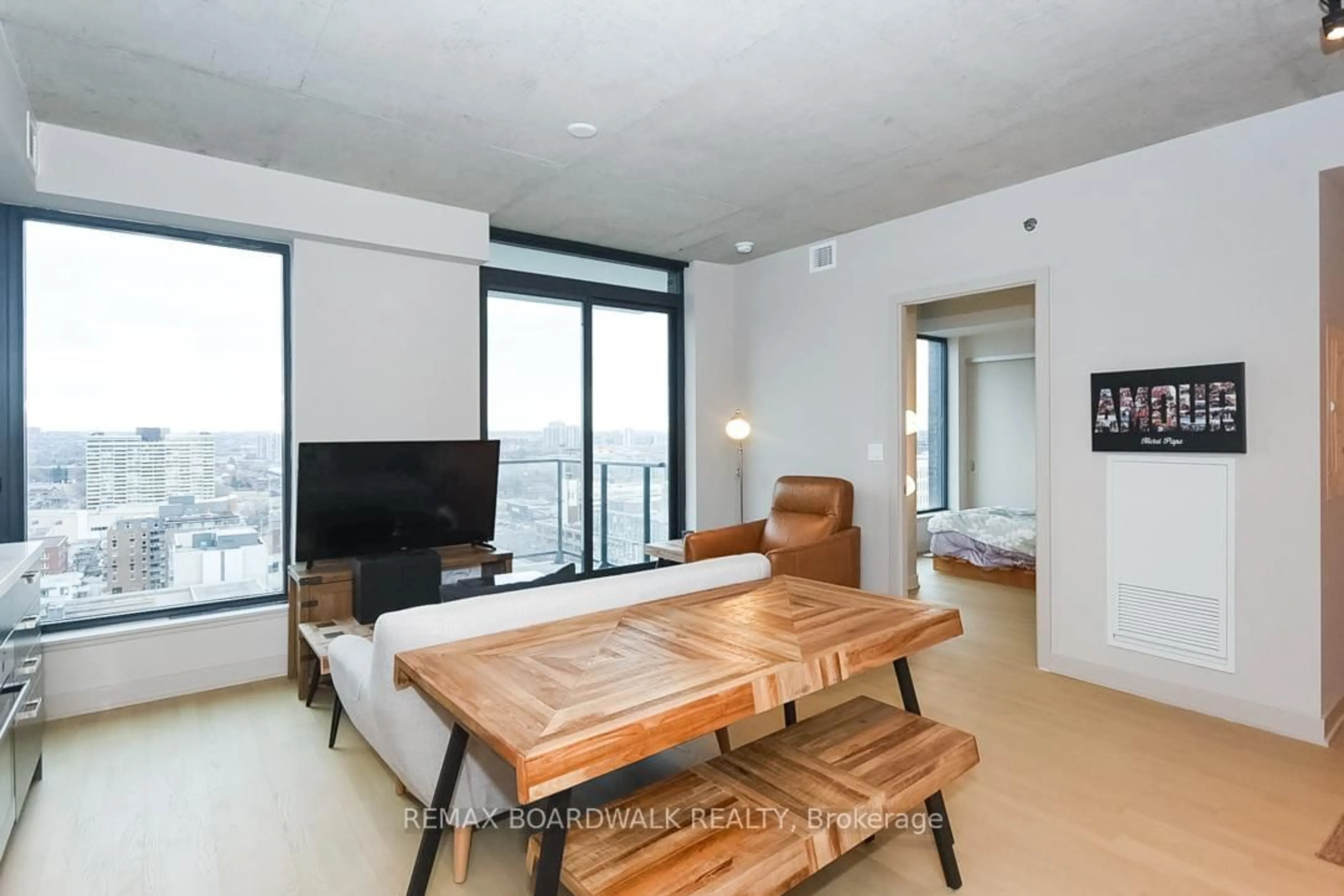 Living room with furniture, unknown for 203 Catherine St #1709, Ottawa Ontario K2P 1J5