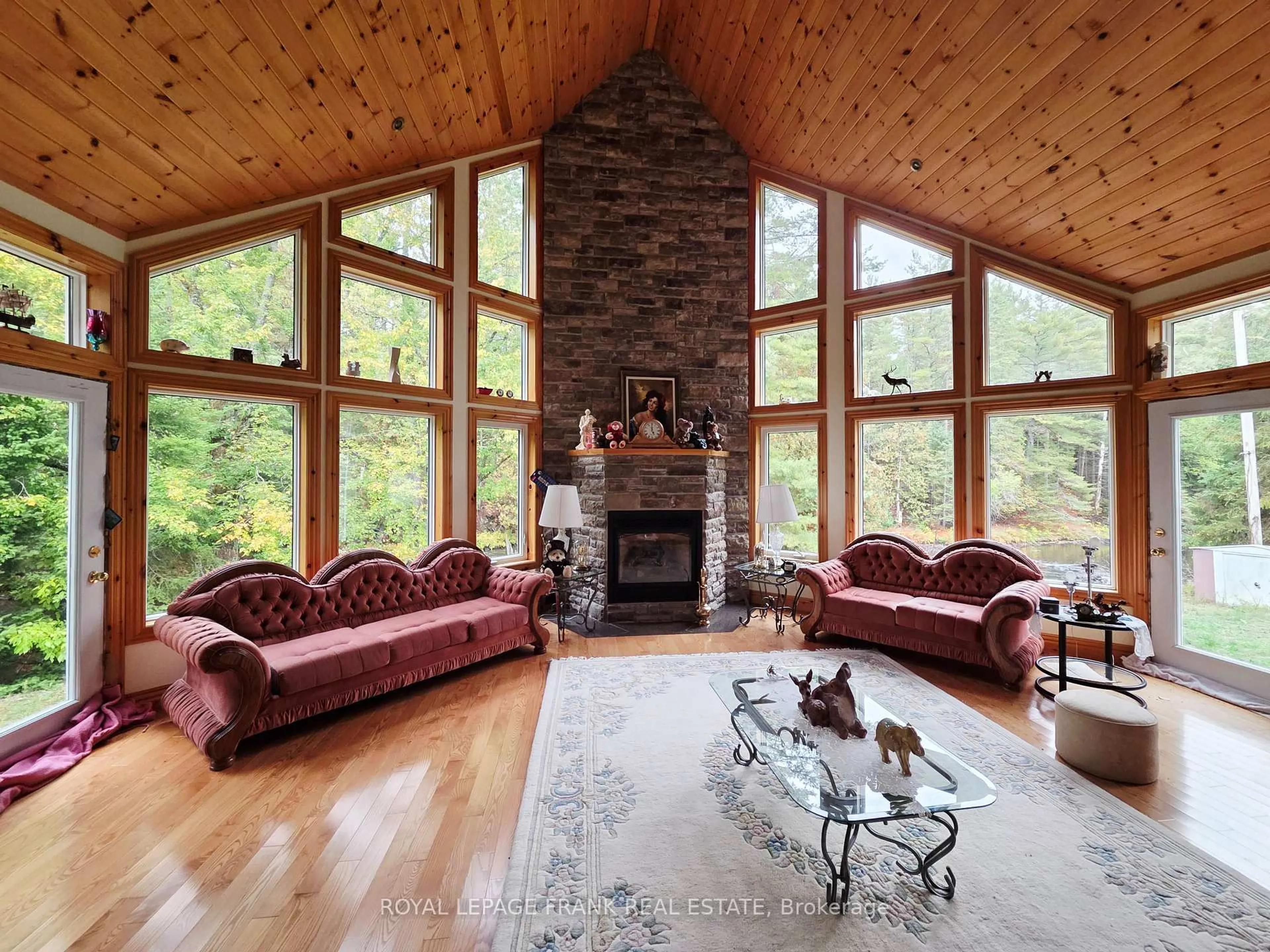 Living room with furniture, wood/laminate floor for 8847 Highway 28, North Kawartha Ontario K0L 1A0