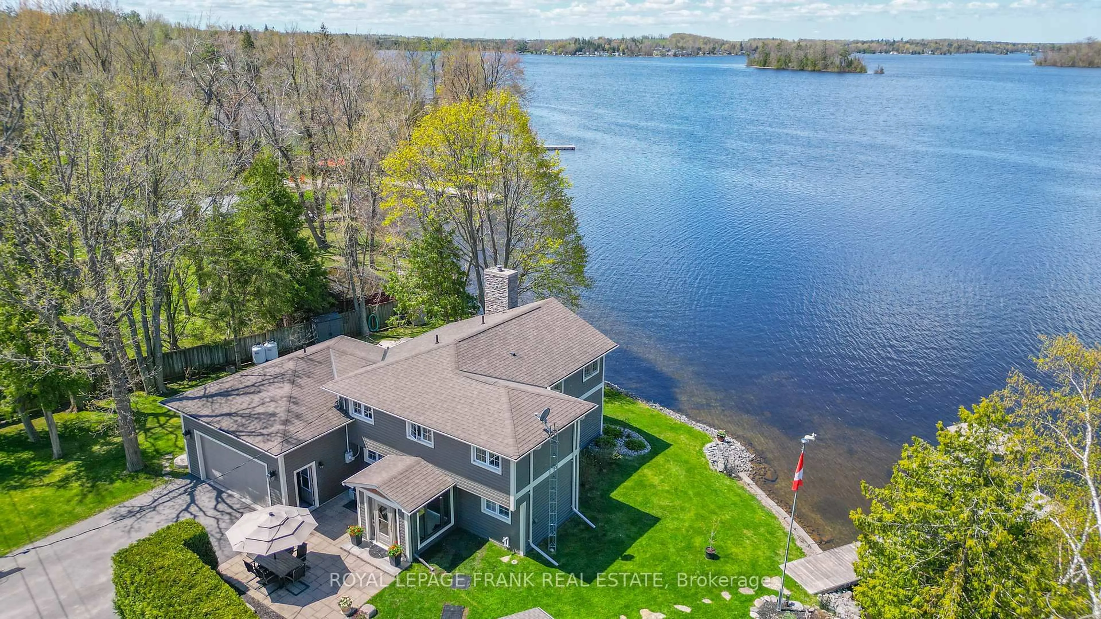 A pic from outside/outdoor area/front of a property/back of a property/a pic from drone, water/lake/river/ocean view for 11 EDGEWATER Dr, Selwyn Ontario K0L 1T0