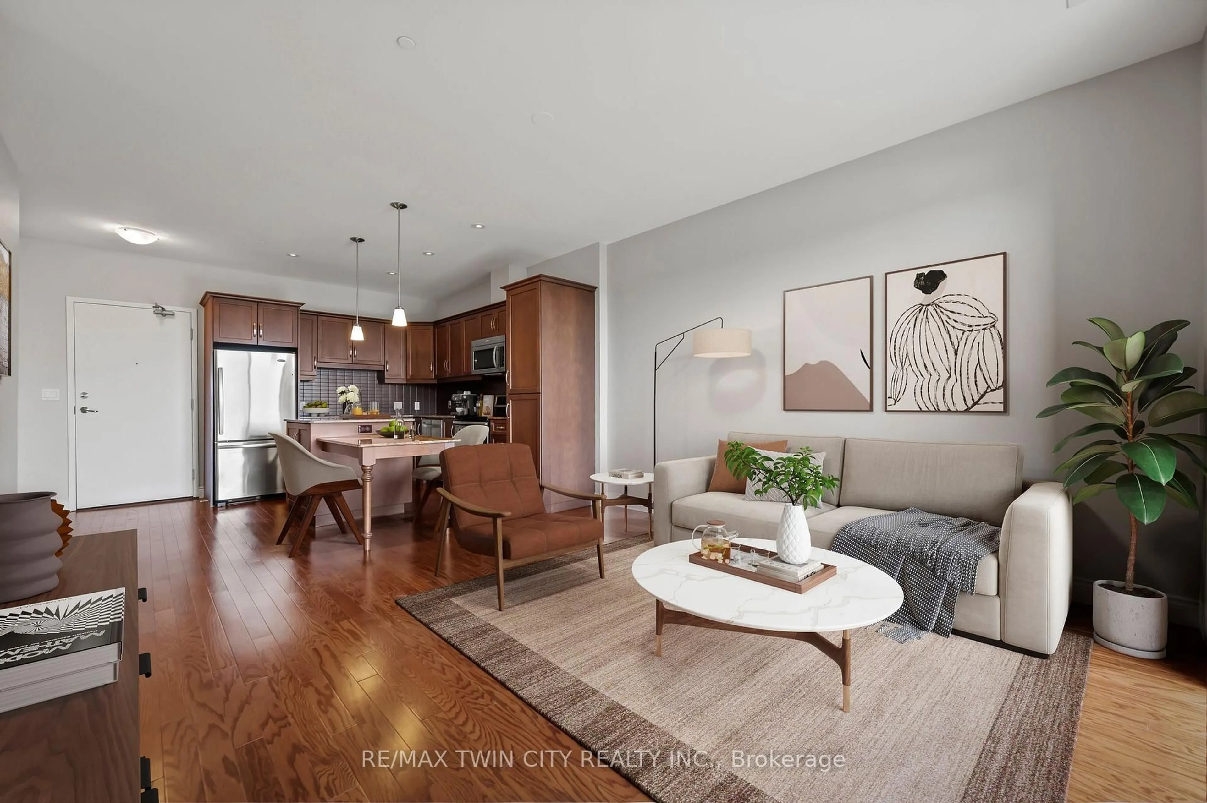 Open concept kitchen, wood/laminate floor for 223 Erb St #704, Waterloo Ontario N2L 0B3