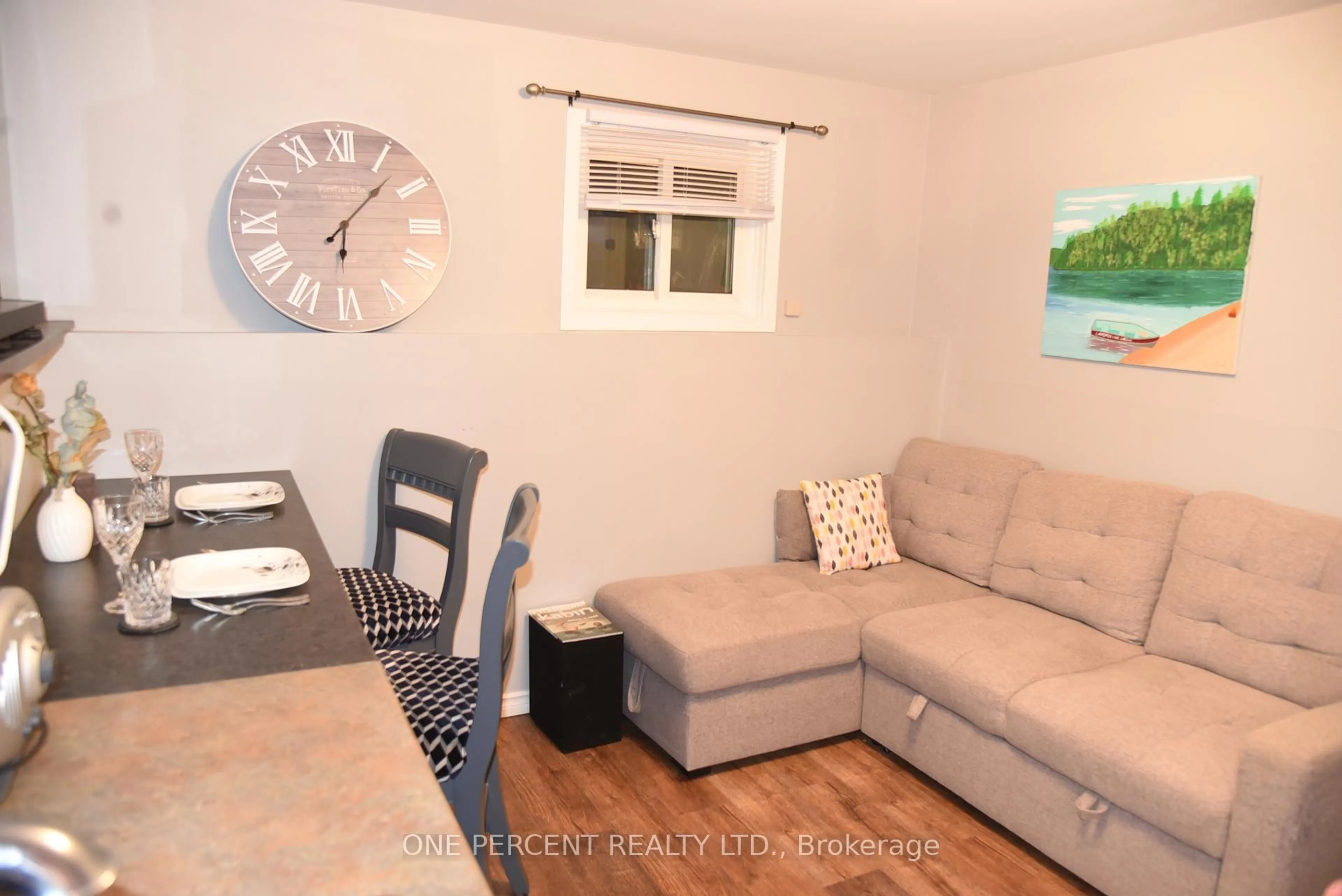 Living room with furniture, wood/laminate floor for 31 Prince St, Minden Hills Ontario K0M 2K0