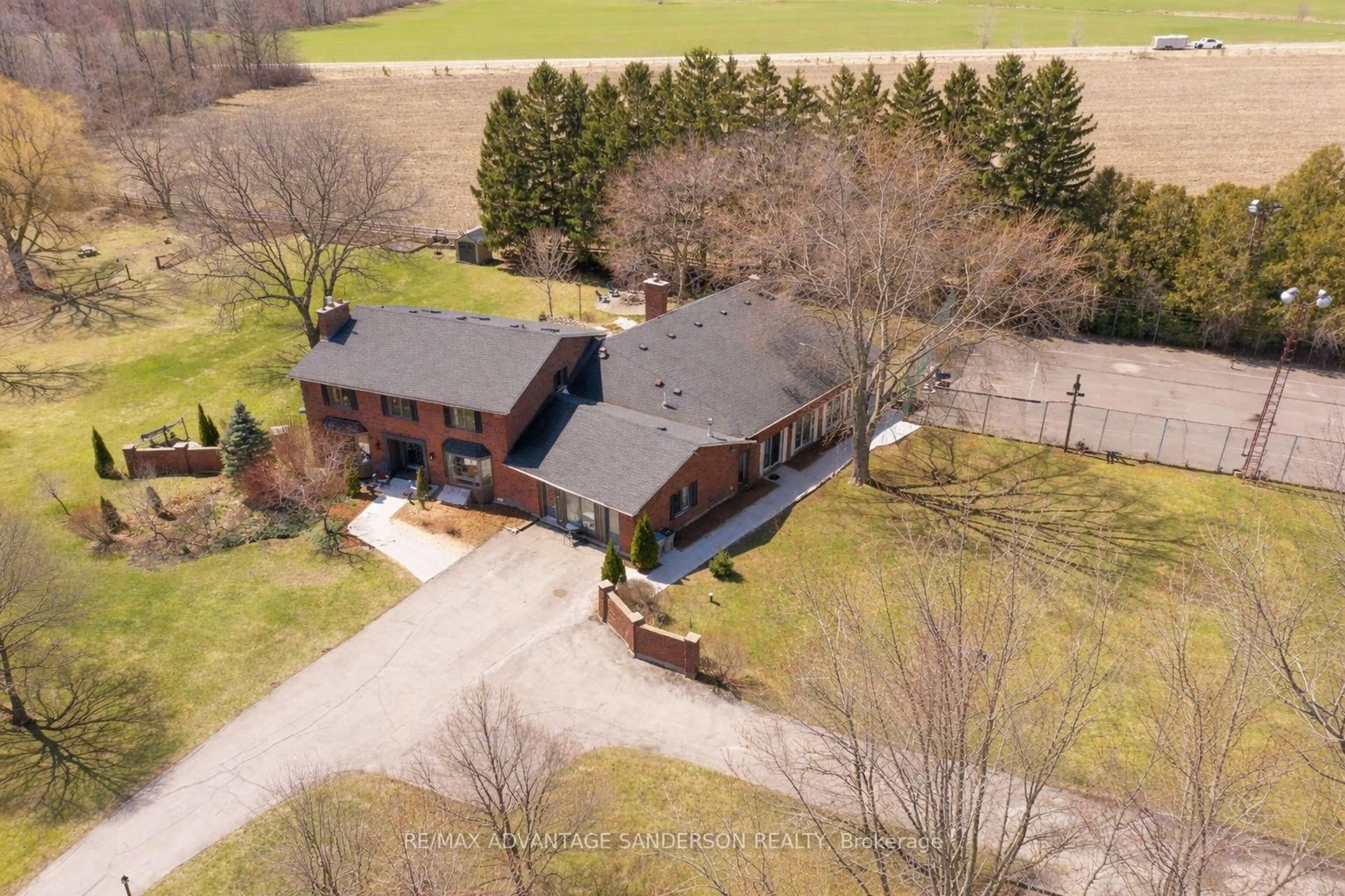 A pic from outside/outdoor area/front of a property/back of a property/a pic from drone, street for 21727 Vanneck Rd, Middlesex Centre Ontario N0L 1R0